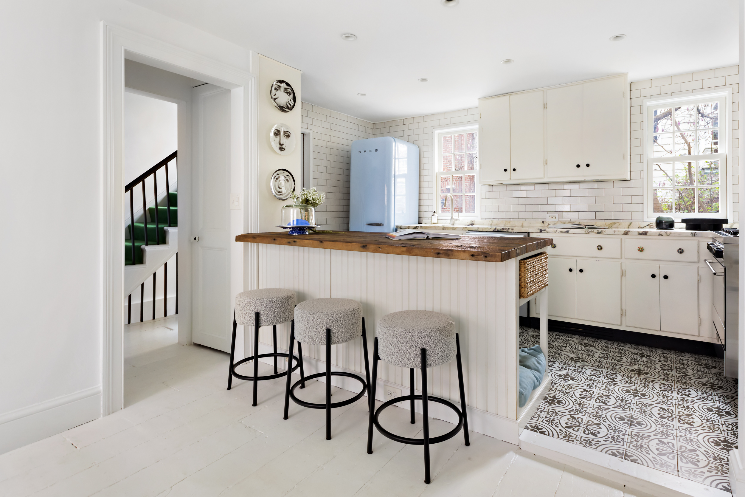49 Barrow Street Manhattan, NY 10014 - Photo 7 of 25 a kitchen with granite countertop a sink cabinets and stainless steel appliances