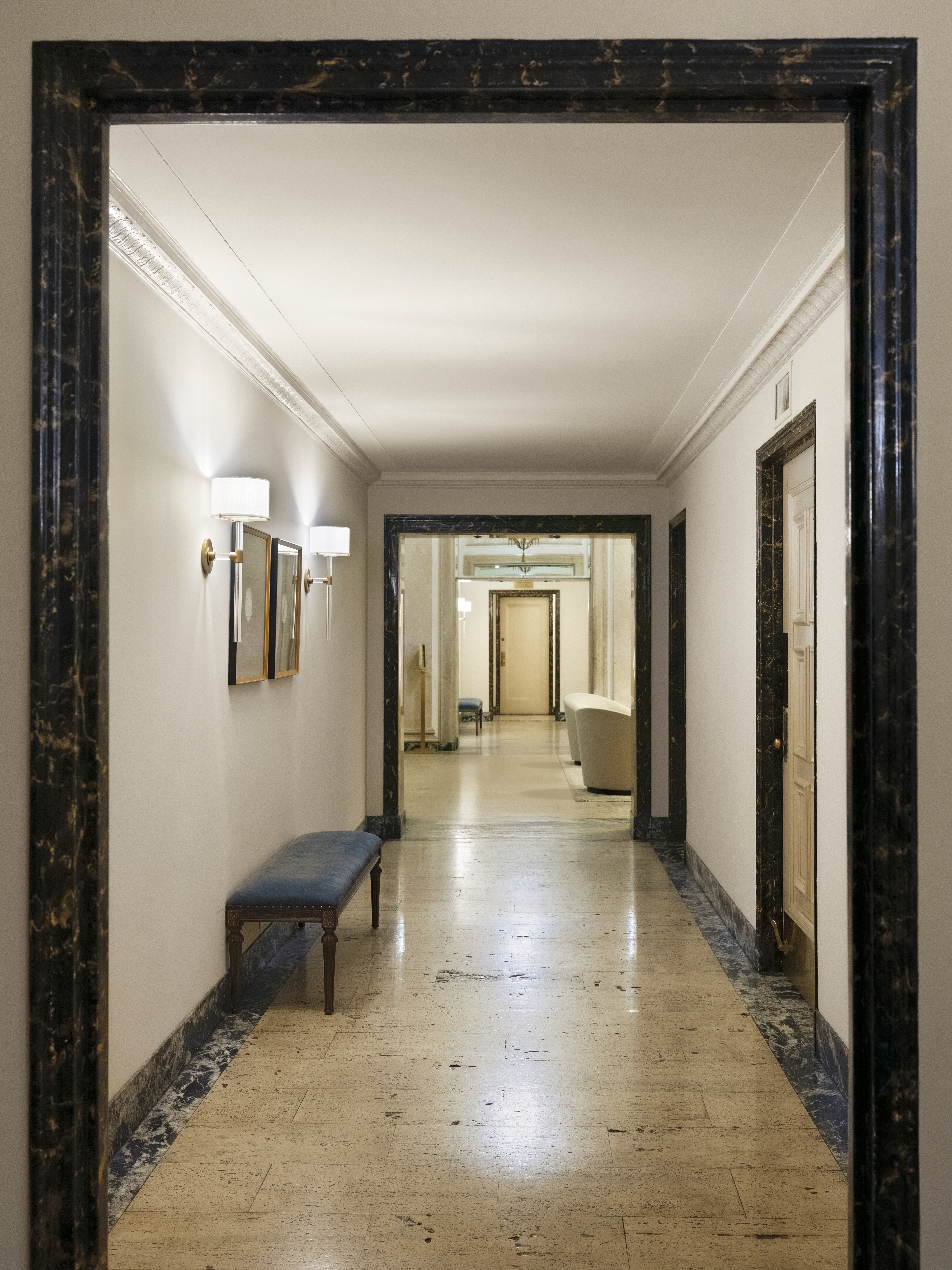 1158 5th Avenue, Unit 4A Manhattan, NY 10128 - Photo 19 of 24 a view of a hallway with wooden floor and furniture