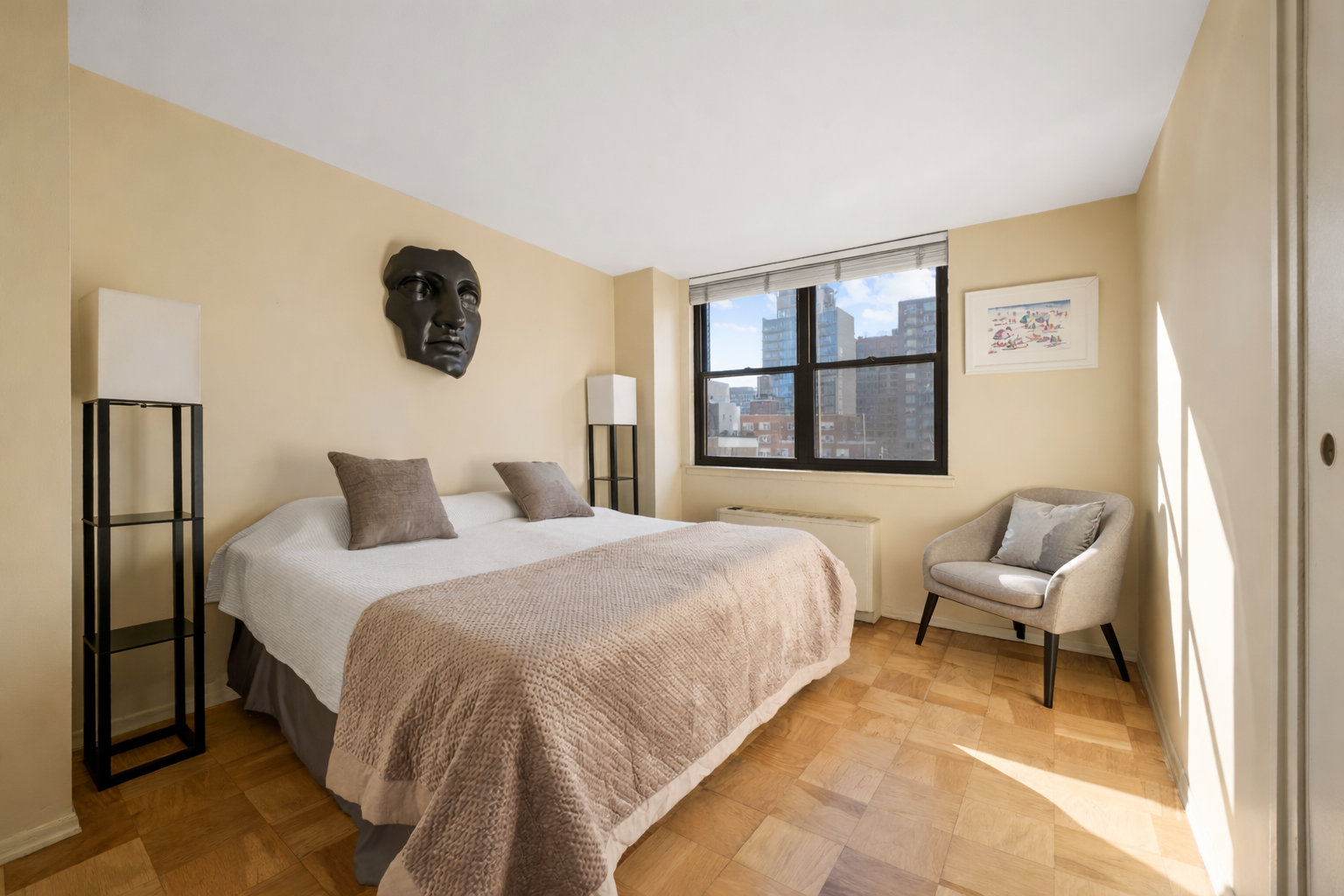 225 East 36th Street, Unit 10N Manhattan, NY 10016 - Photo 9 of 13 a bedroom with a bed and a painting on the wall