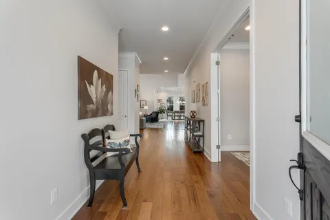 a view of entryway with wooden floor and stairs