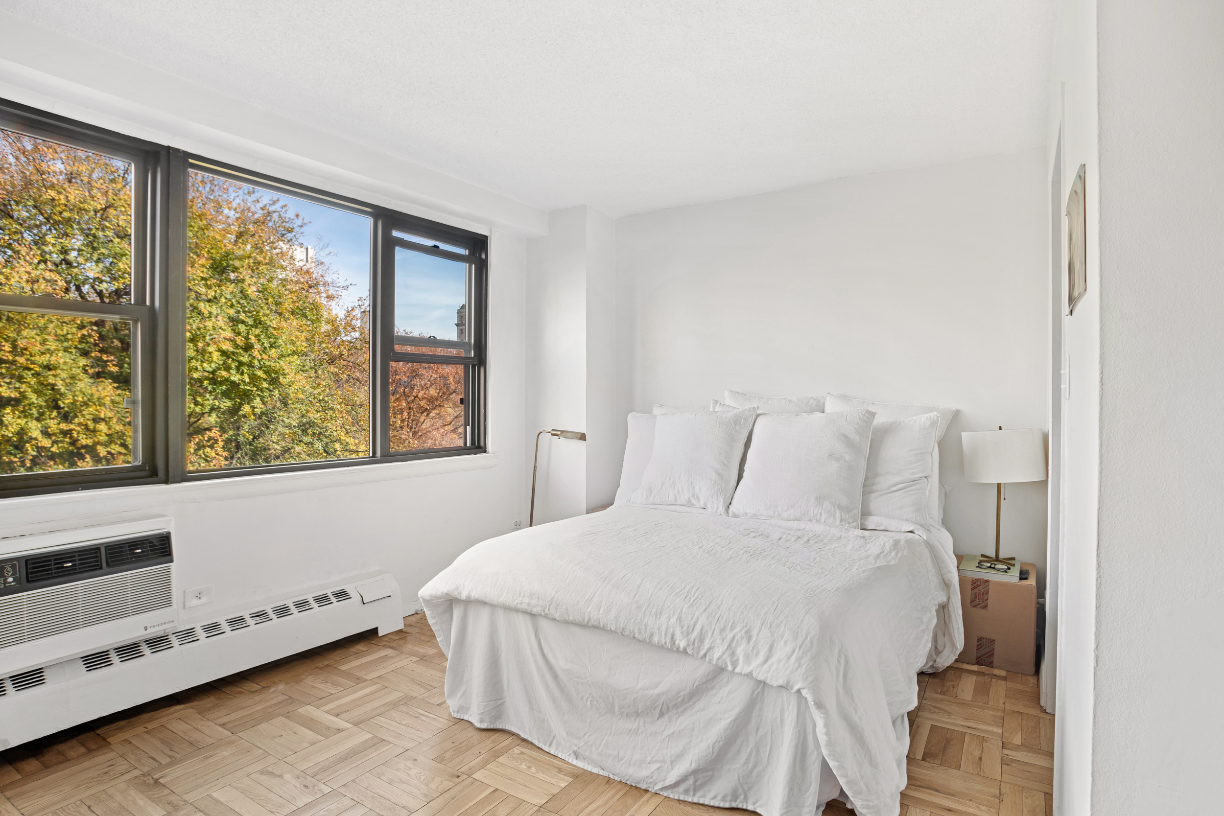 230 East 15th Street, Unit 6C Manhattan, NY 10003 - Photo 4 of 9 a bedroom with a bed and a window