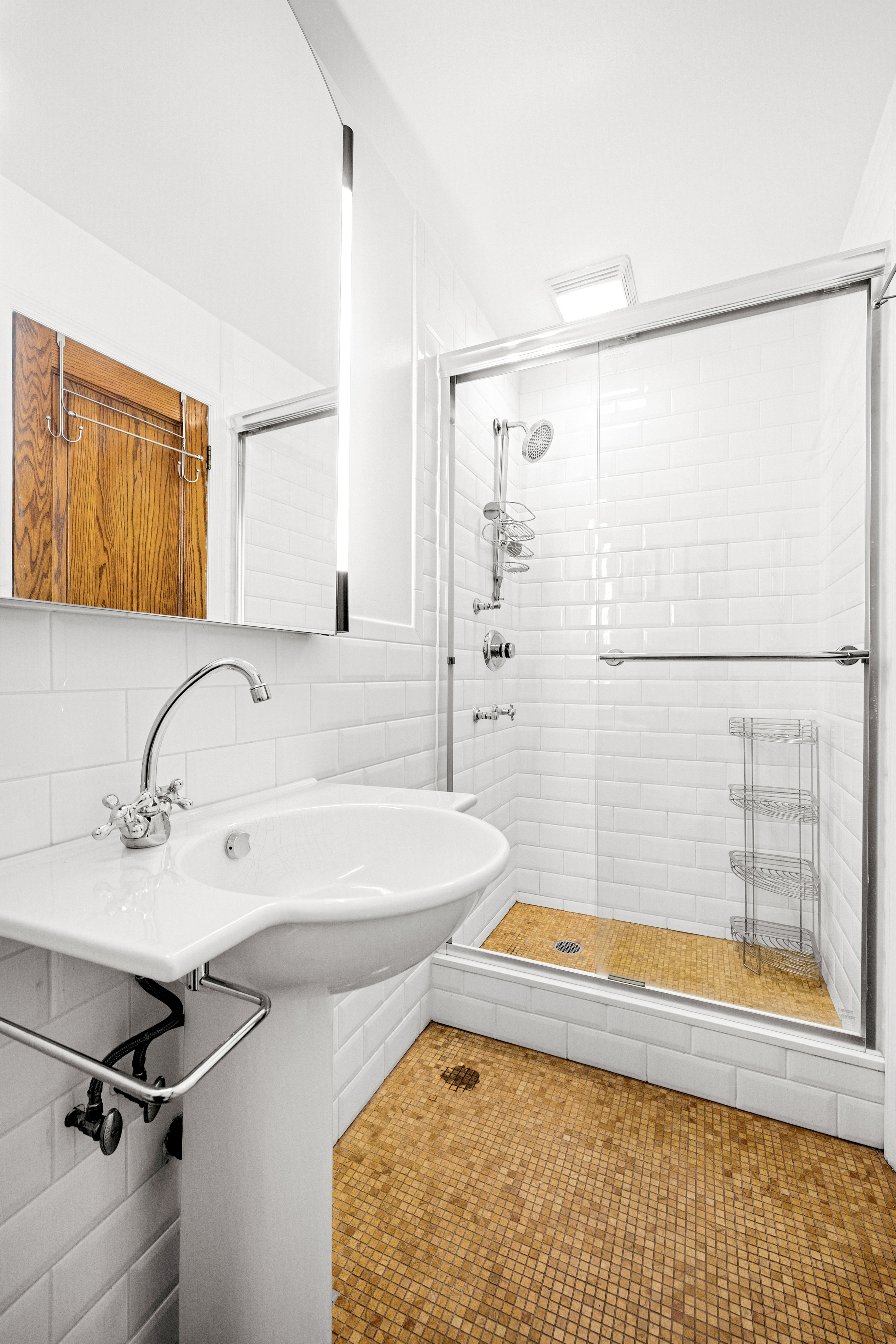 154 West 77th Street, Unit #1 Manhattan, NY 10024 - Photo 5 of 10 a bathroom with a tub a sink and a window