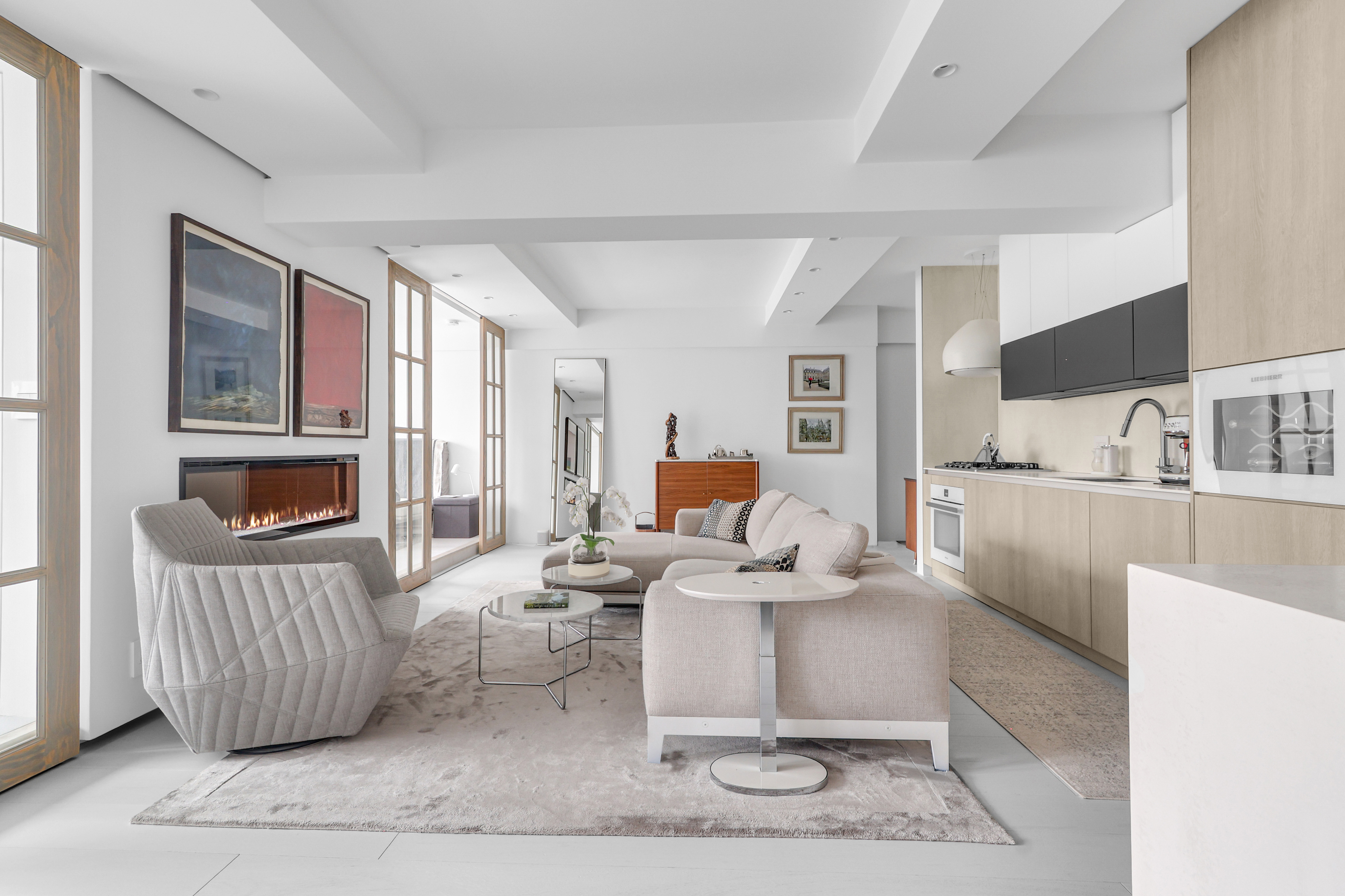 120 Central Park South, Unit 2 B C Manhattan, NY 10019 - Photo 1 of 13 a living room with furniture and a wooden floor