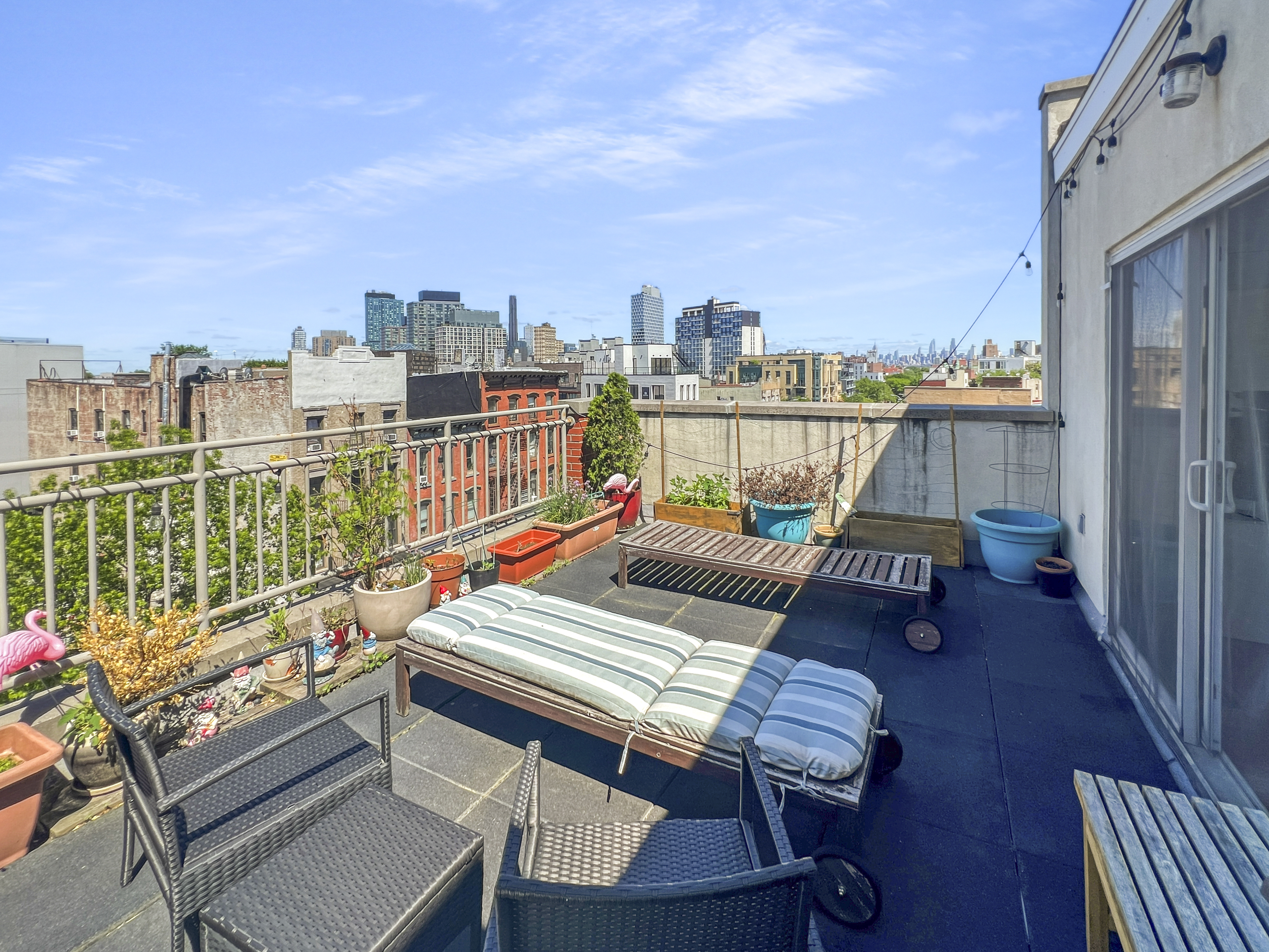643 Washington Avenue, Unit 2 Brooklyn, NY 11238 - Photo 8 of 12 a view of a balcony with wooden benches