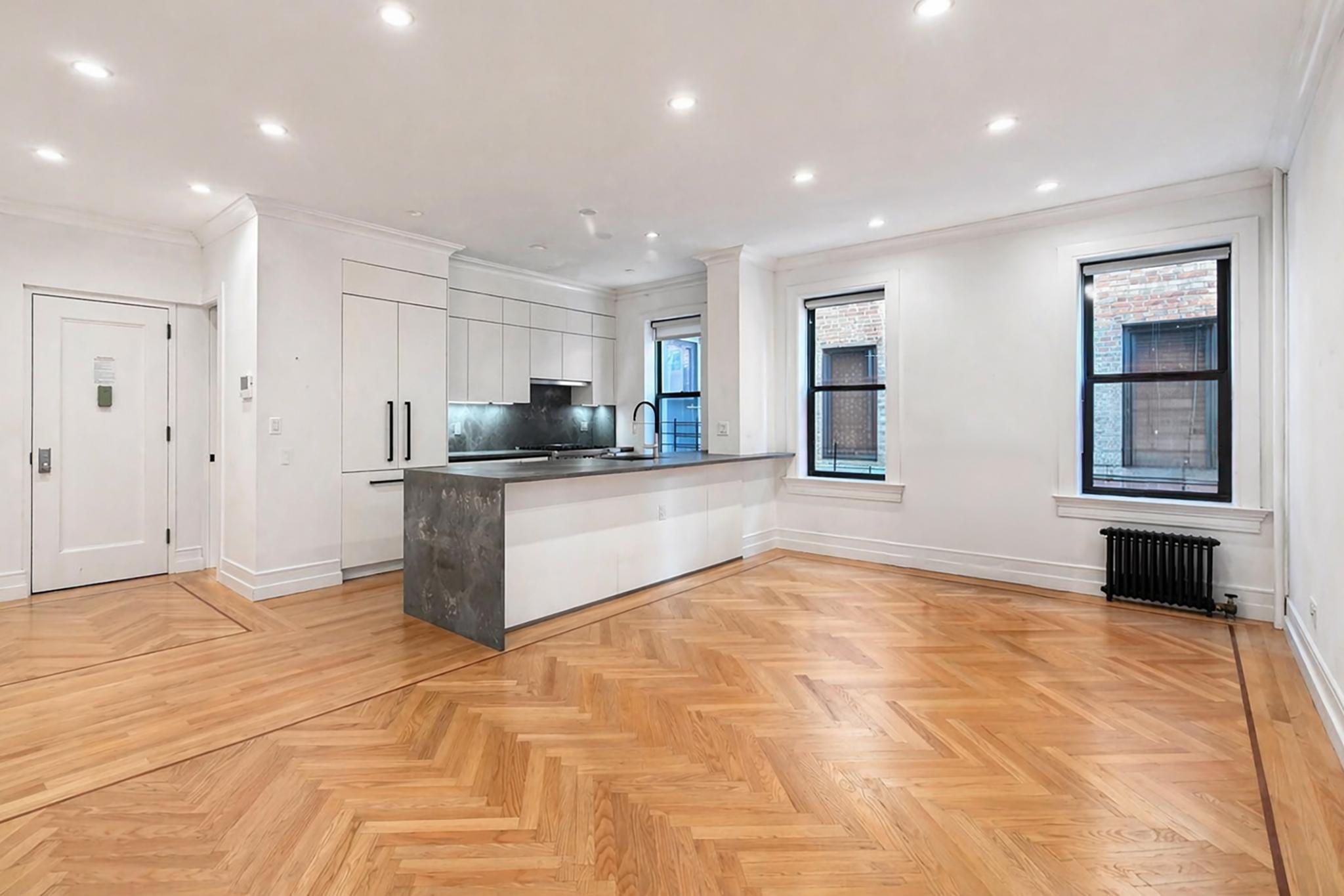 24-39 38th Street, Unit B10B9 Queens, NY 11103 - Photo 2 of 20 a view of kitchen with refrigerator and window