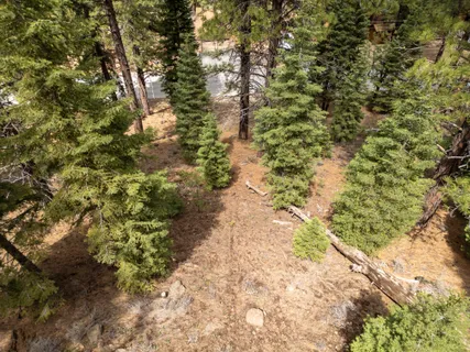 an aerial view of a houses with yard