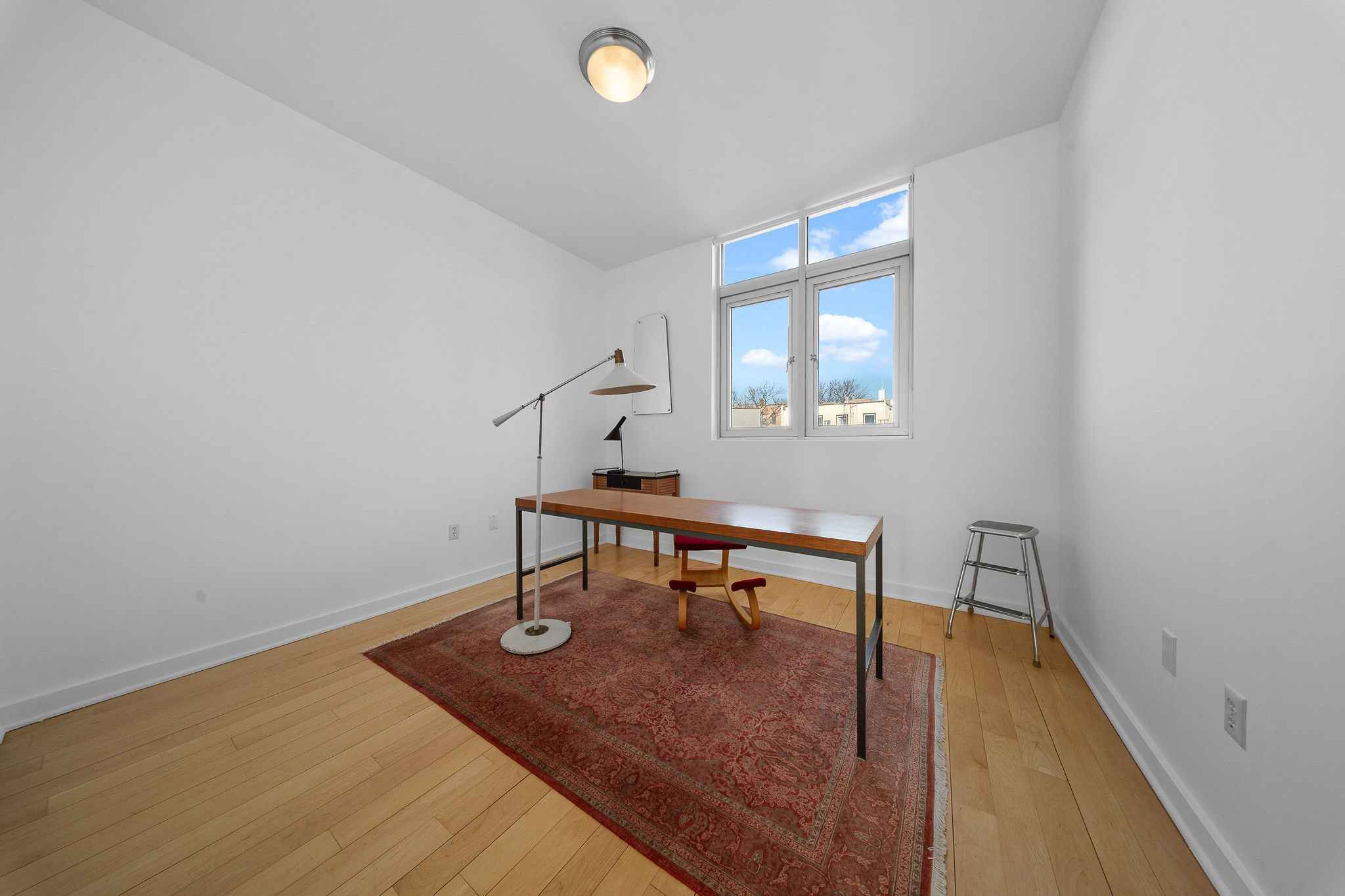 82 Guernsey Street, Unit 3B Brooklyn, NY 11222 - Photo 15 of 18 a view of a room with wooden floor and a window