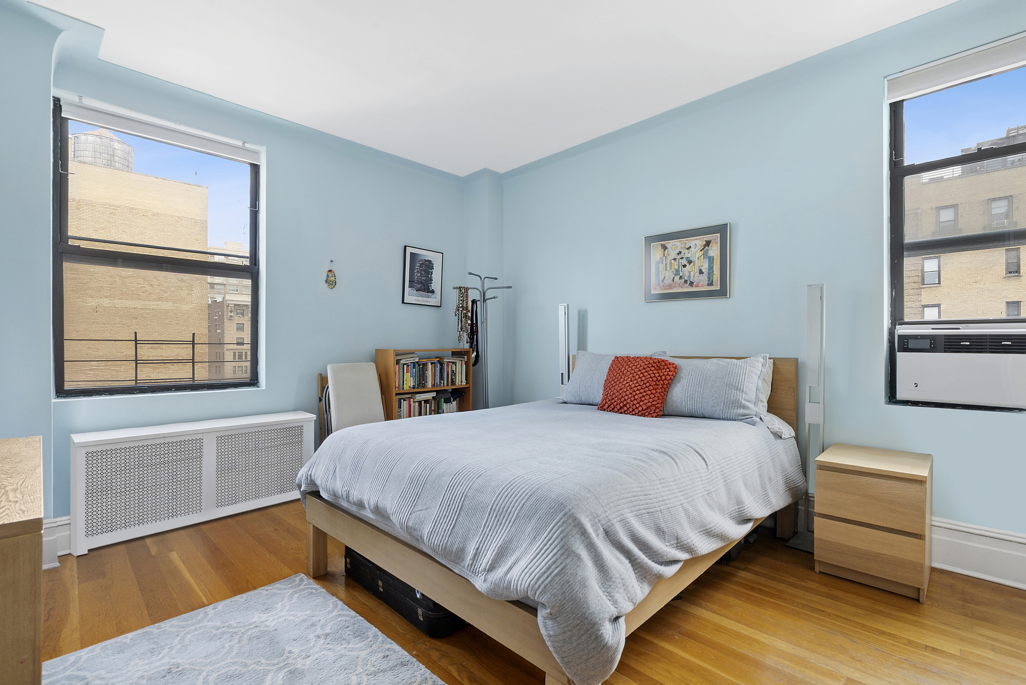 514 West End Avenue, Unit 14A Manhattan, NY 10024 - Photo 4 of 9 a bedroom with a bed and wooden floor