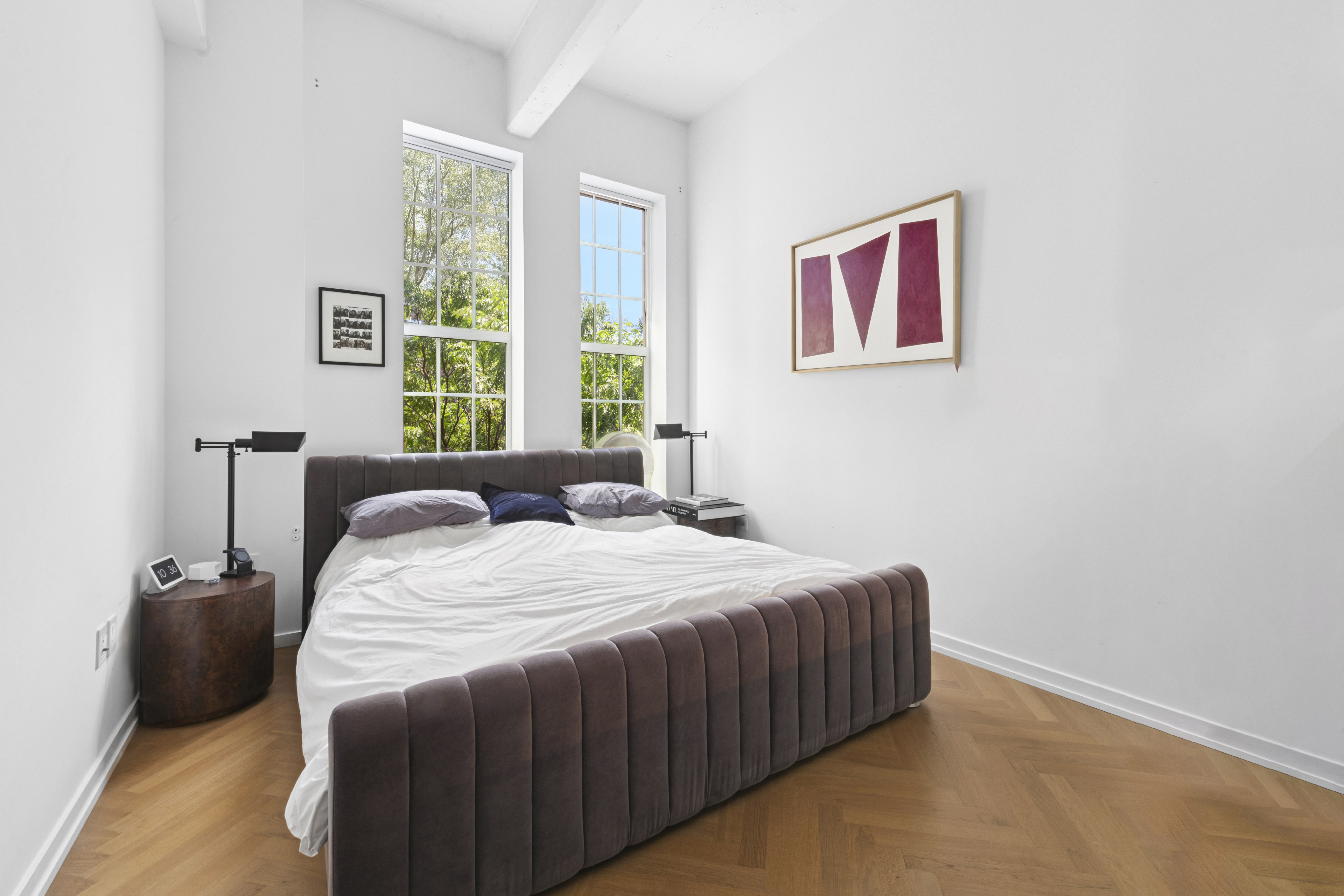 184 Kent Avenue, Unit D315 Brooklyn, NY 11249 - Photo 5 of 19 a bedroom with a bed and a large window