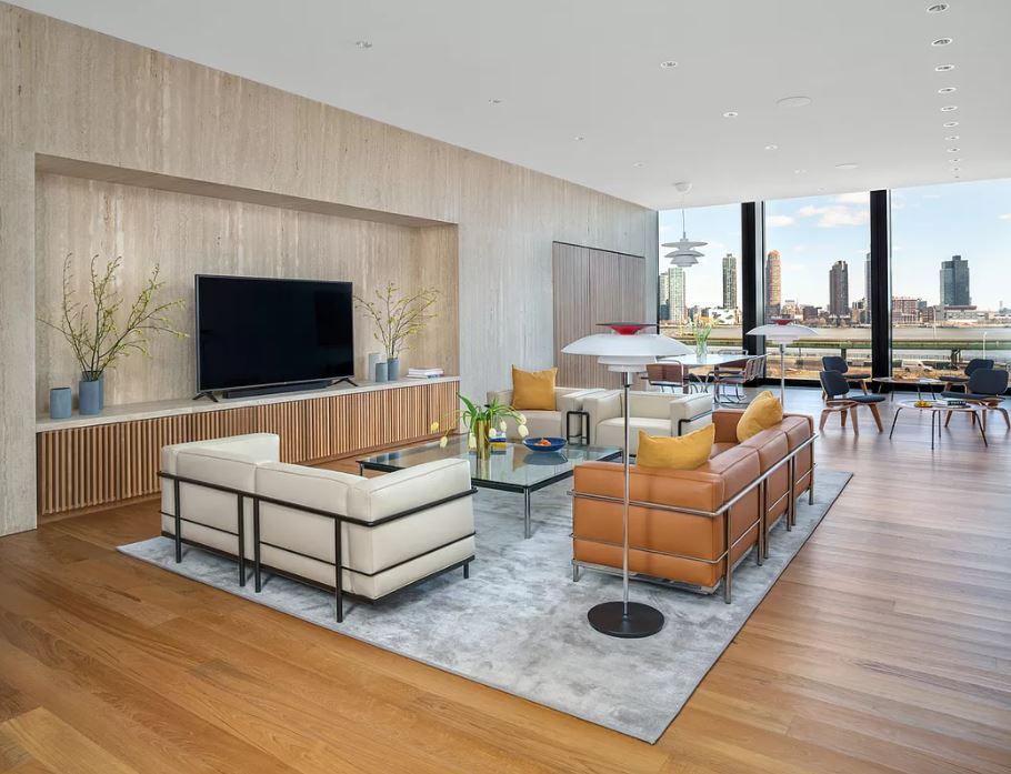 695 1st Avenue, Unit 34A Manhattan, NY 10016 - Photo 14 of 21 a living room with furniture and a flat screen tv