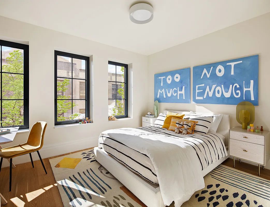 533 Pacific Street, Unit TH537 Brooklyn, NY 11217 - Photo 19 of 25 a bedroom with a bed and wooden floor