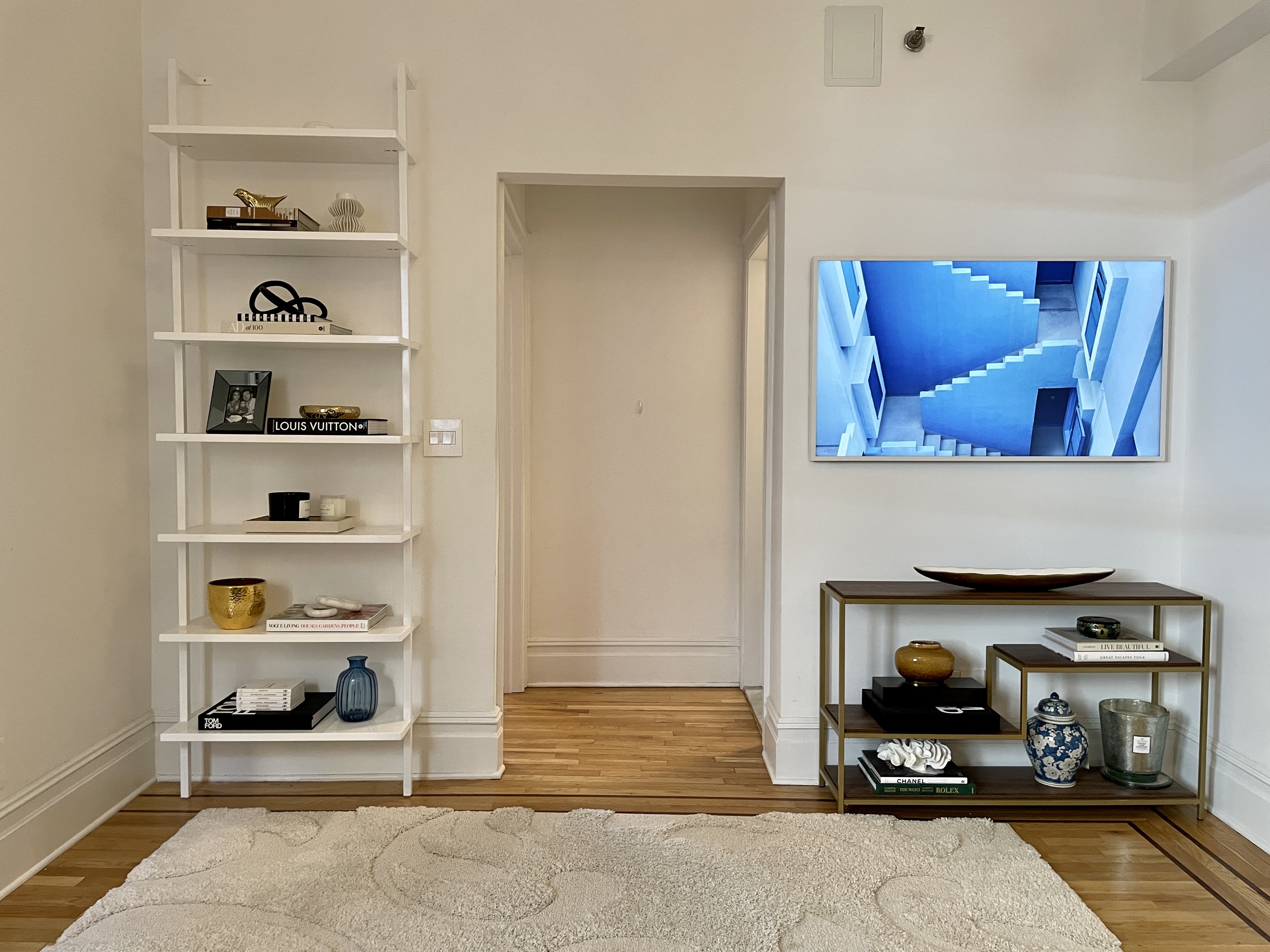 203 West 90th Street, Unit 6B Manhattan, NY 10024 - Photo 10 of 22 a living room with furniture and a book shelf