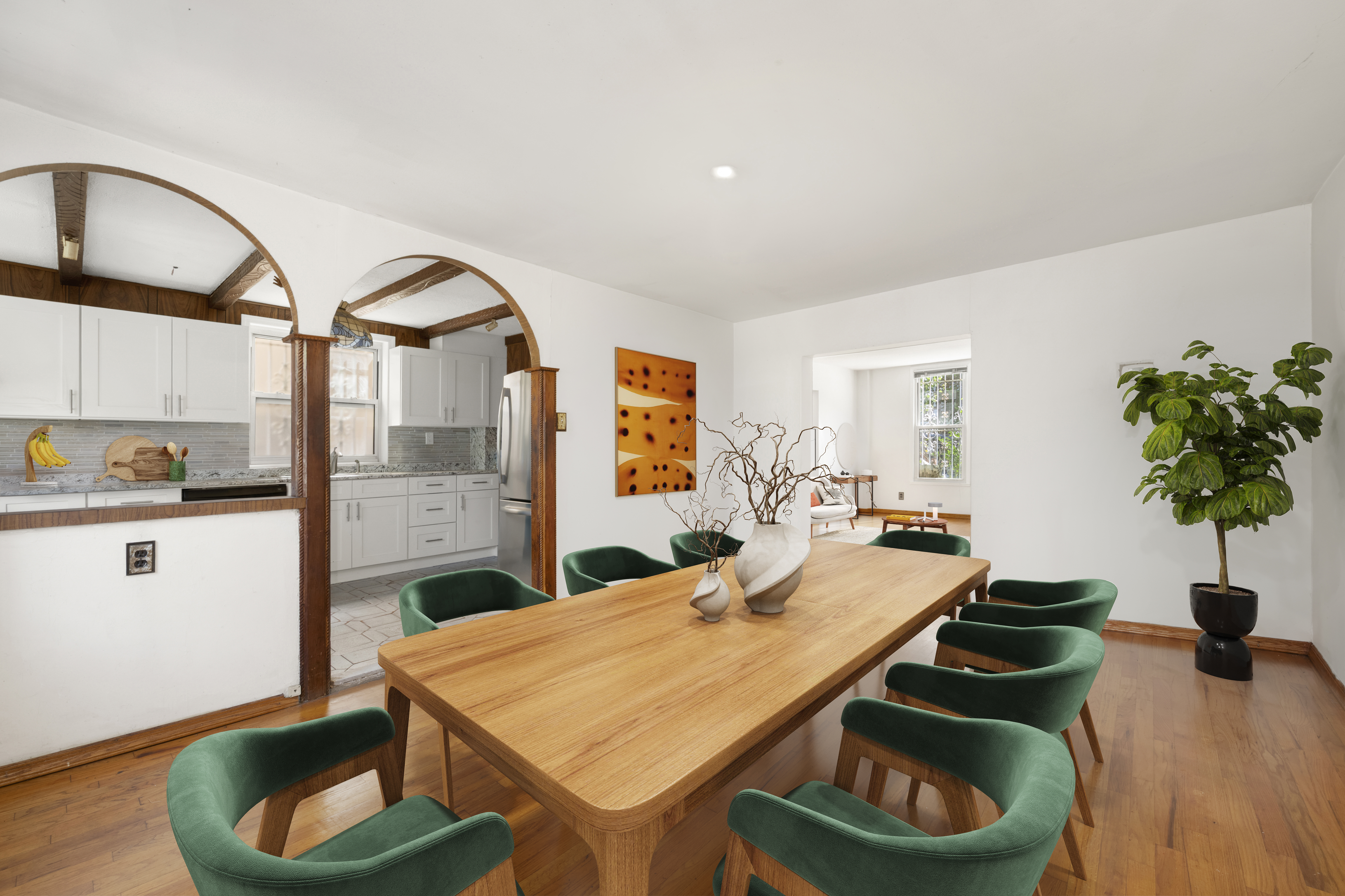 37-34 28th Street Queens, NY 11101 - Photo 5 of 17 a kitchen with stainless steel appliances kitchen island granite countertop a table and chairs in it