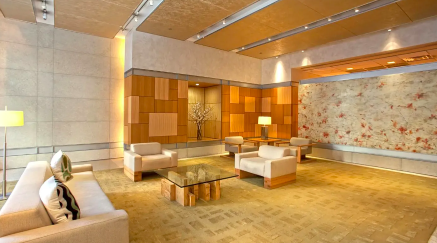 450 East 83rd Street, Unit 9E Manhattan, NY 10028 - Photo 14 of 18 a living room with furniture and a large window