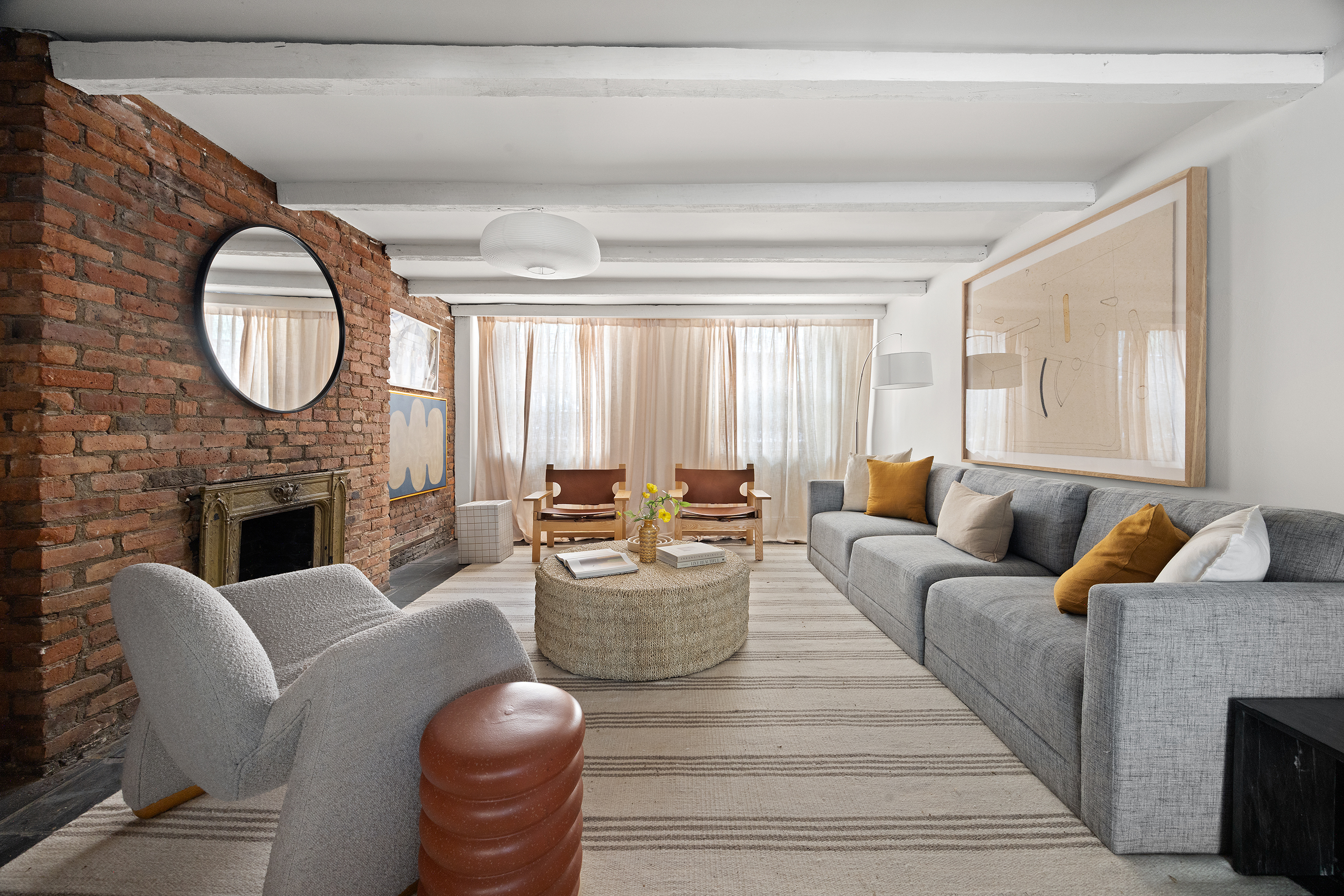 765 Greenwich Street, Unit 1 Manhattan, NY 10014 - Photo 7 of 18 a living room with furniture a fireplace and a large window