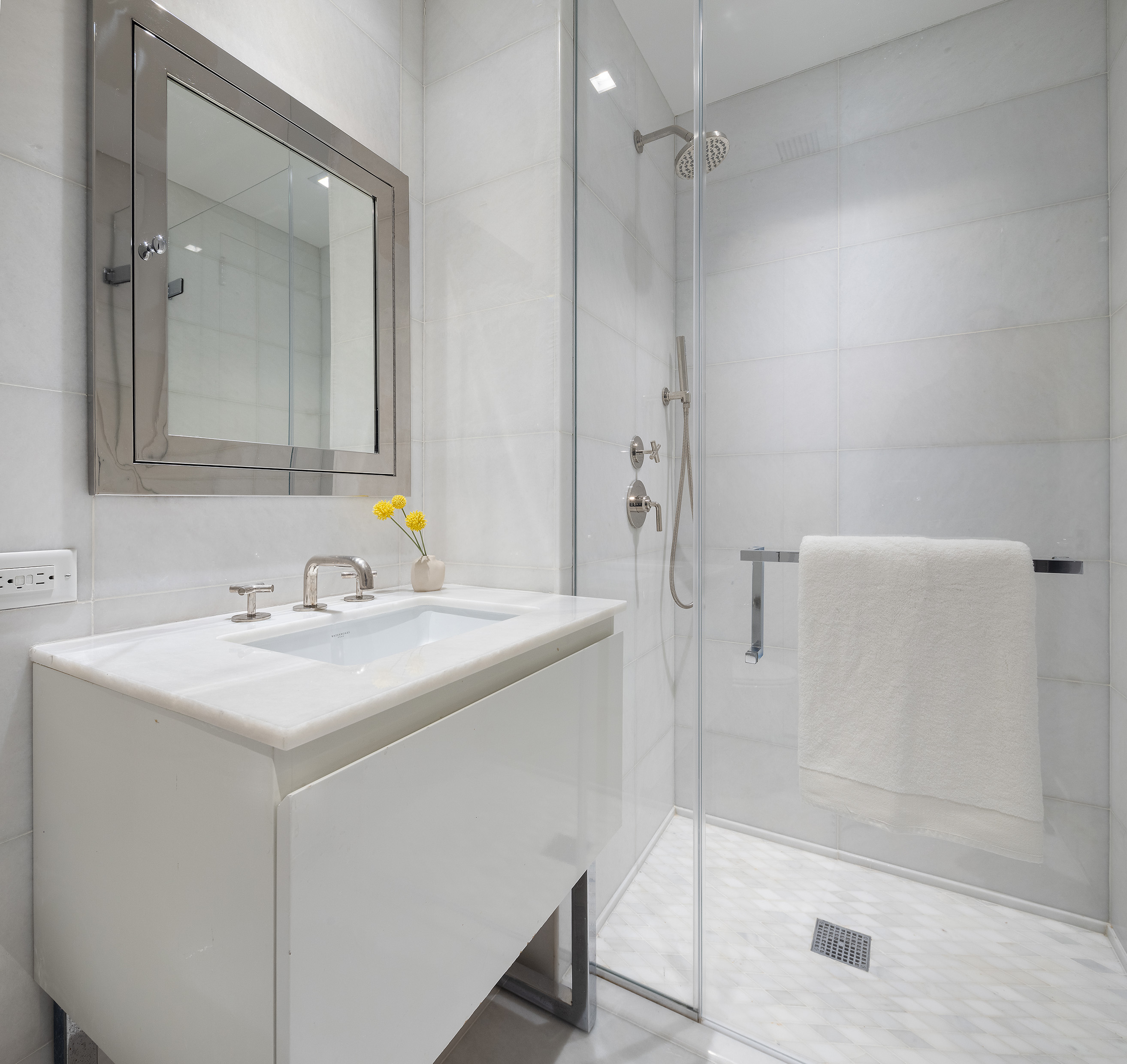 5 Franklin Place, Unit 9D Manhattan, NY 10013 - Photo 13 of 20 a bathroom with a sink shower and a mirror