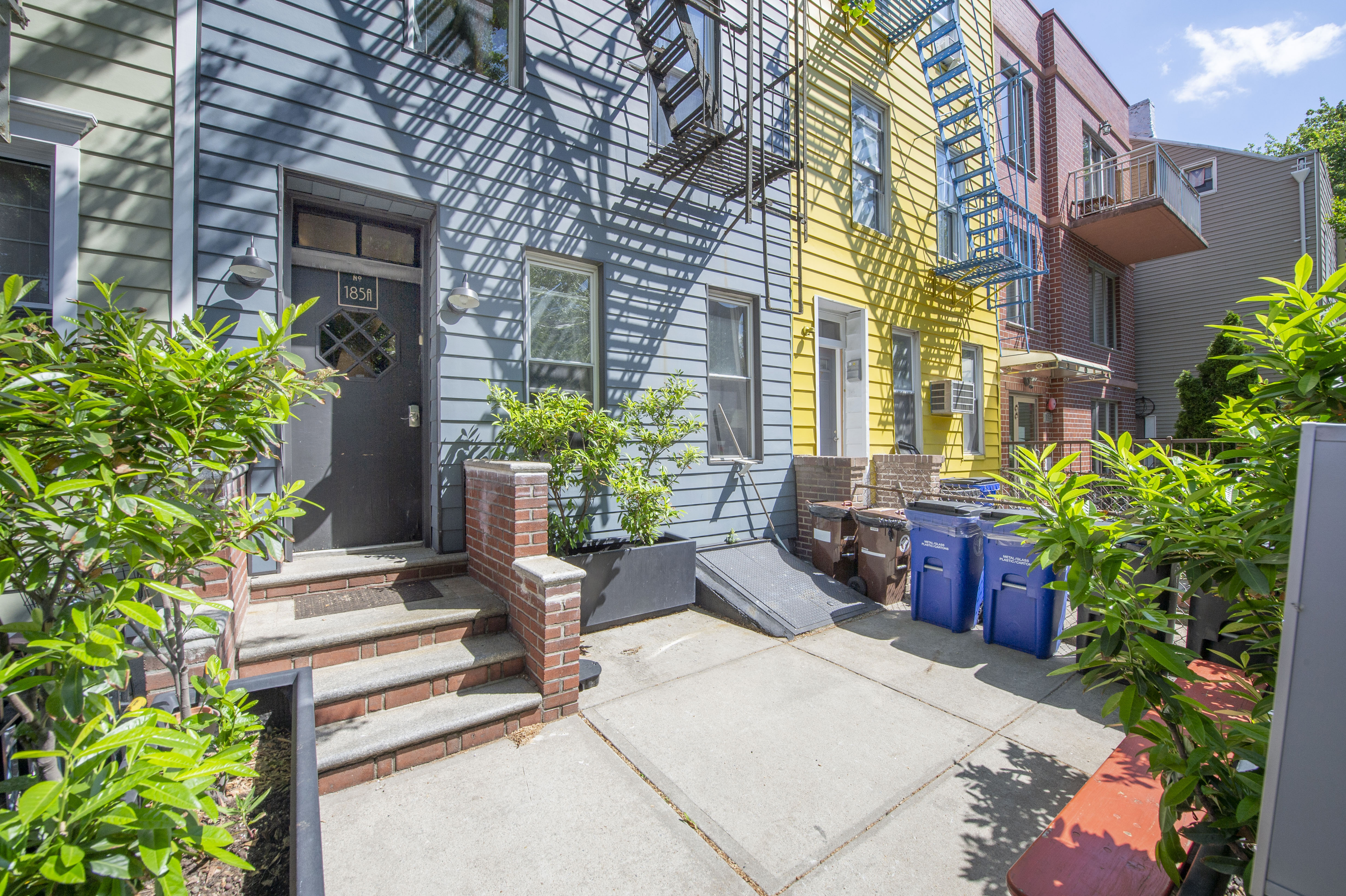 185 A Powers Street, Unit 1 Brooklyn, NY 11211 - Photo 11 of 13 a view of a building with potted plants