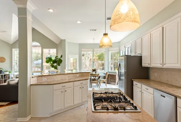 a kitchen with sink cabinets and refrigerator
