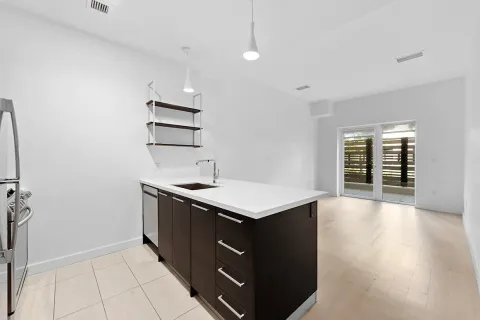 an empty room with wooden floor