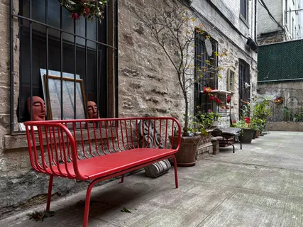 a view of a patio with table and chairs