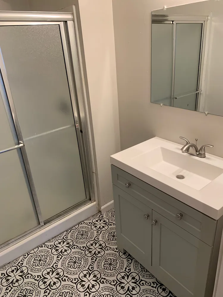 a bathroom with a sink and a mirror