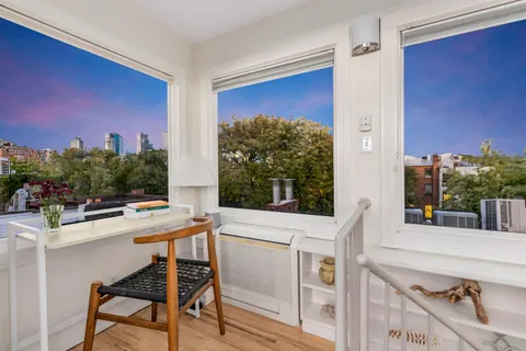 a view of a workspace with furniture