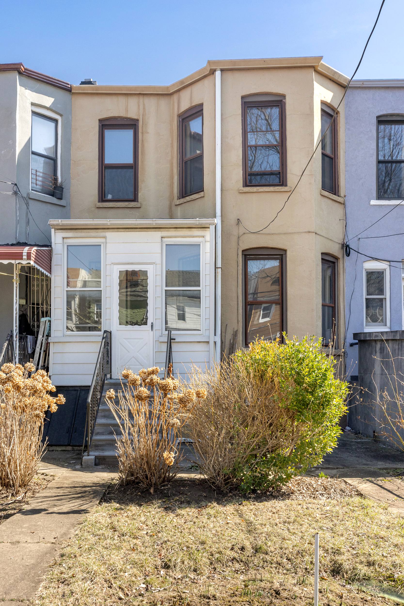 304 East 8th Street Brooklyn, NY 11218 - Photo 29 of 32 a view of a brick house with many windows