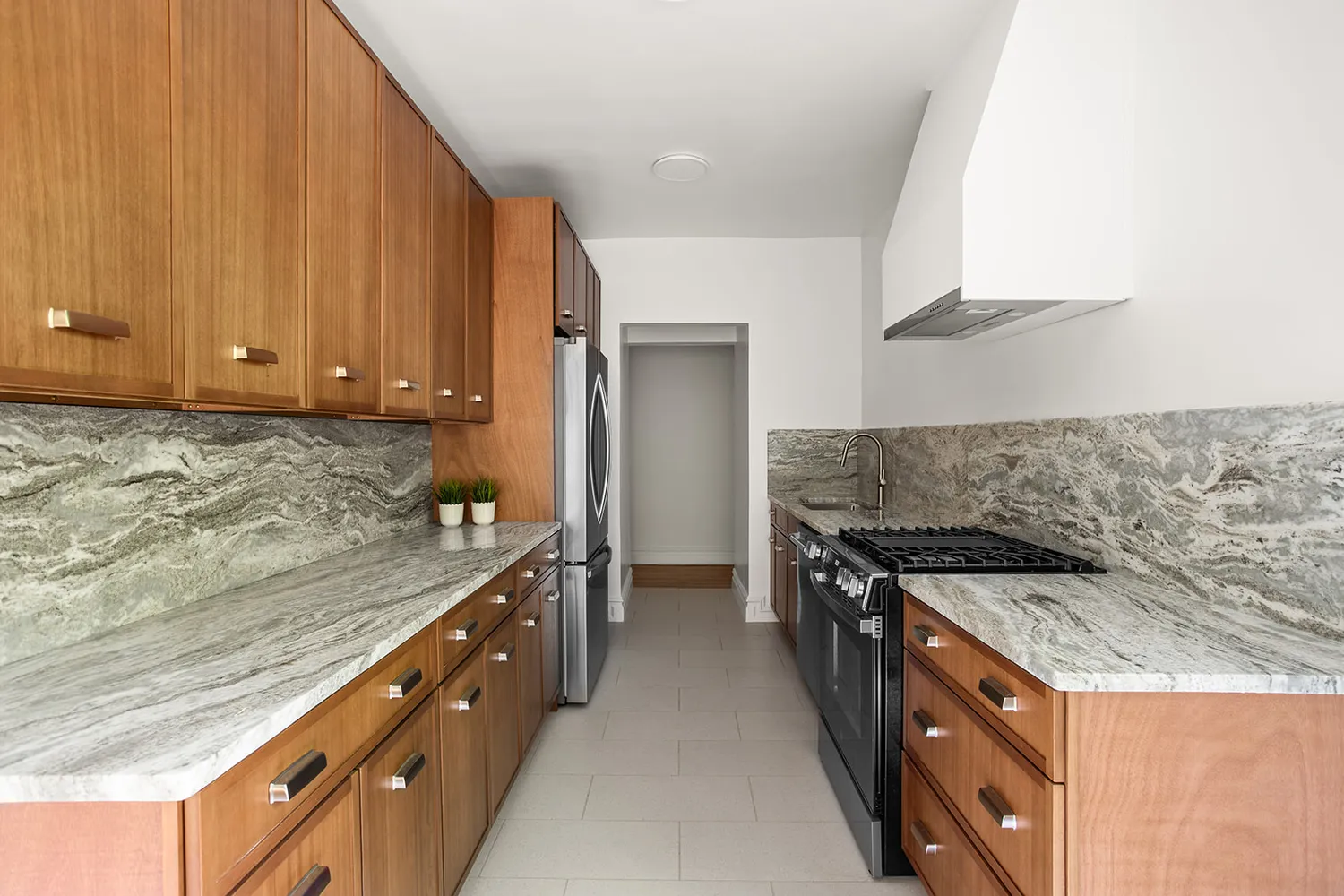 a kitchen with granite countertop a sink and a stove