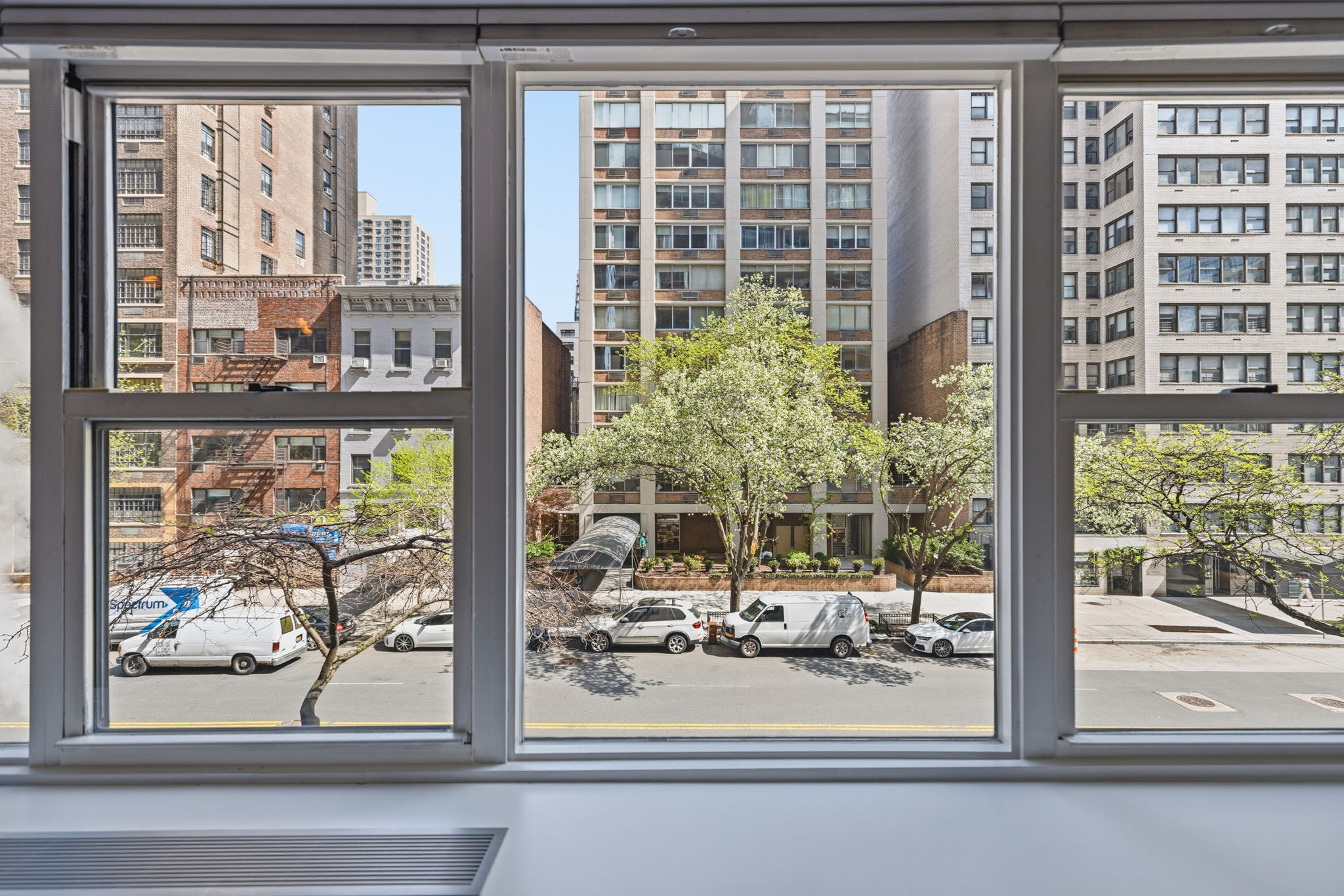 360 East 72nd Street, Unit A306 Manhattan, NY 10021 - Photo 7 of 17 a view of a building from a window