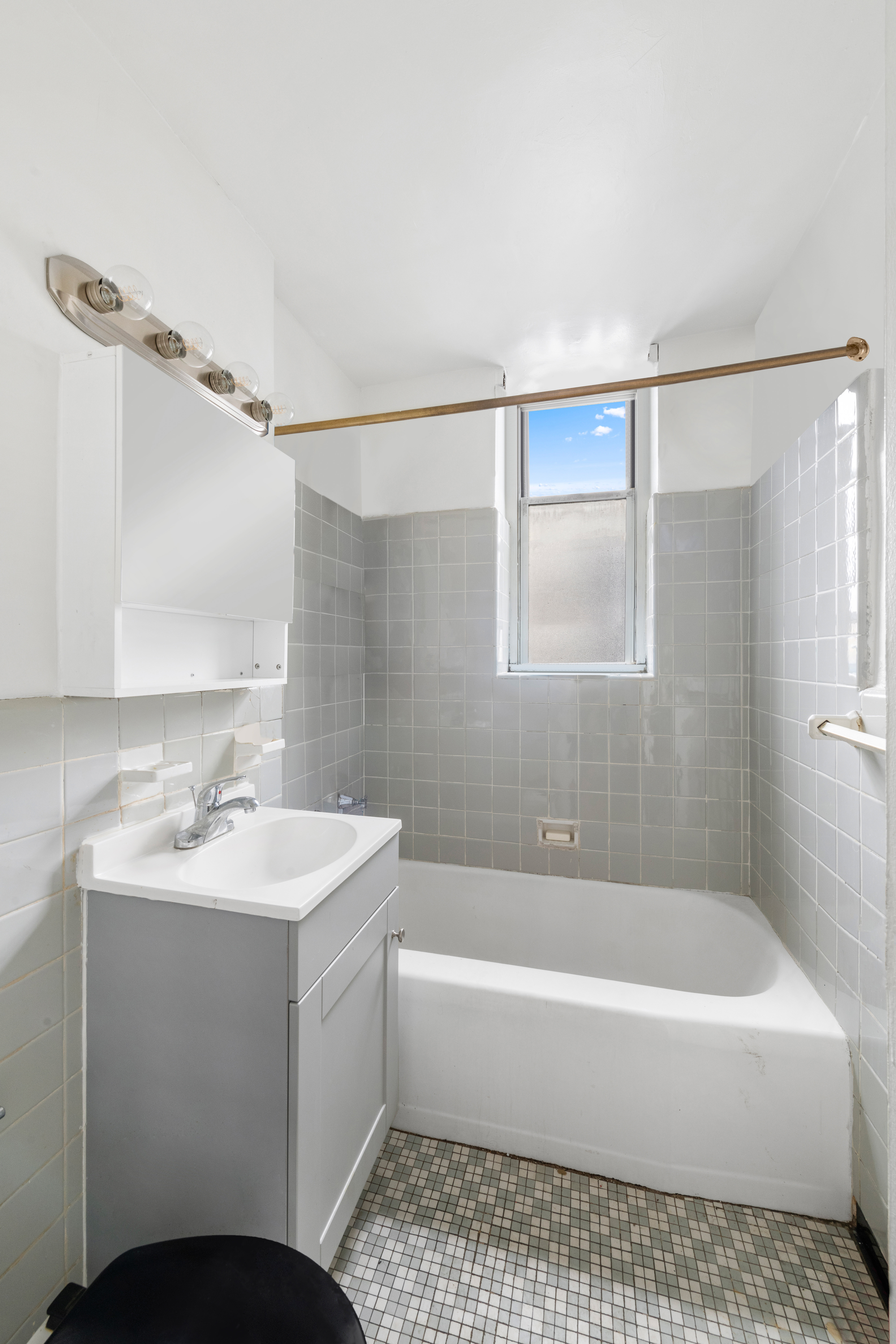 800 Grand Concourse, Unit GMS Bronx, NY 10451 - Photo 8 of 13 a bathroom with a sink a bathtub and a shower