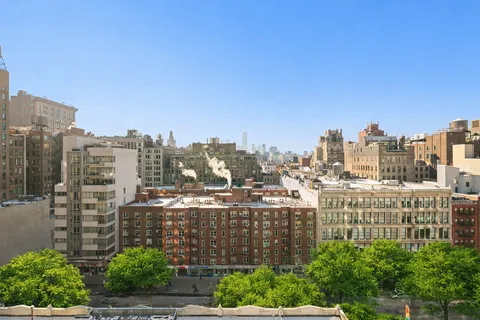 a view of a city that has tall buildings