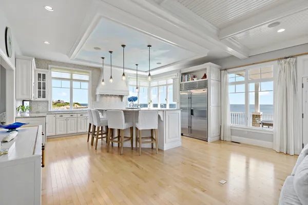 a open kitchen with cabinets table and chairs