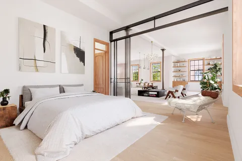 a bedroom with a large bed and a large window