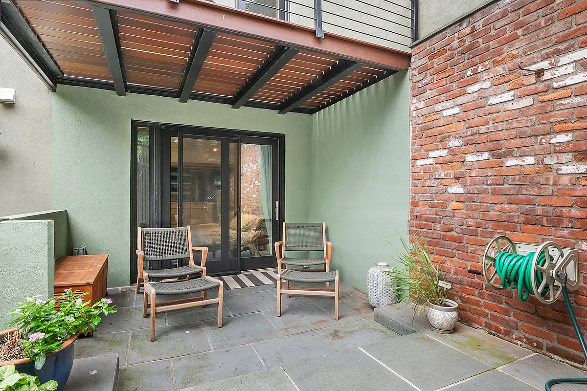 87 Monroe Street, Unit 1 Brooklyn, NY 11216 - Photo 9 of 11 a outdoor living space with furniture and a potted plant