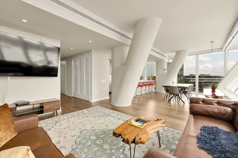 a view of workspace with furniture and window