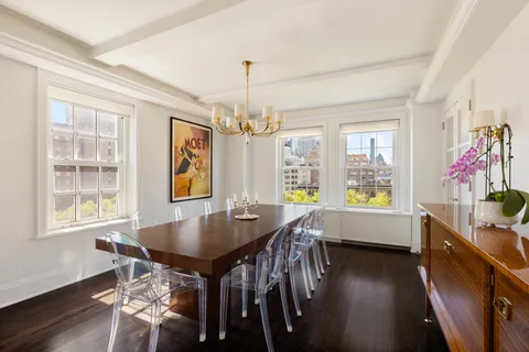 a dining room with furniture and window