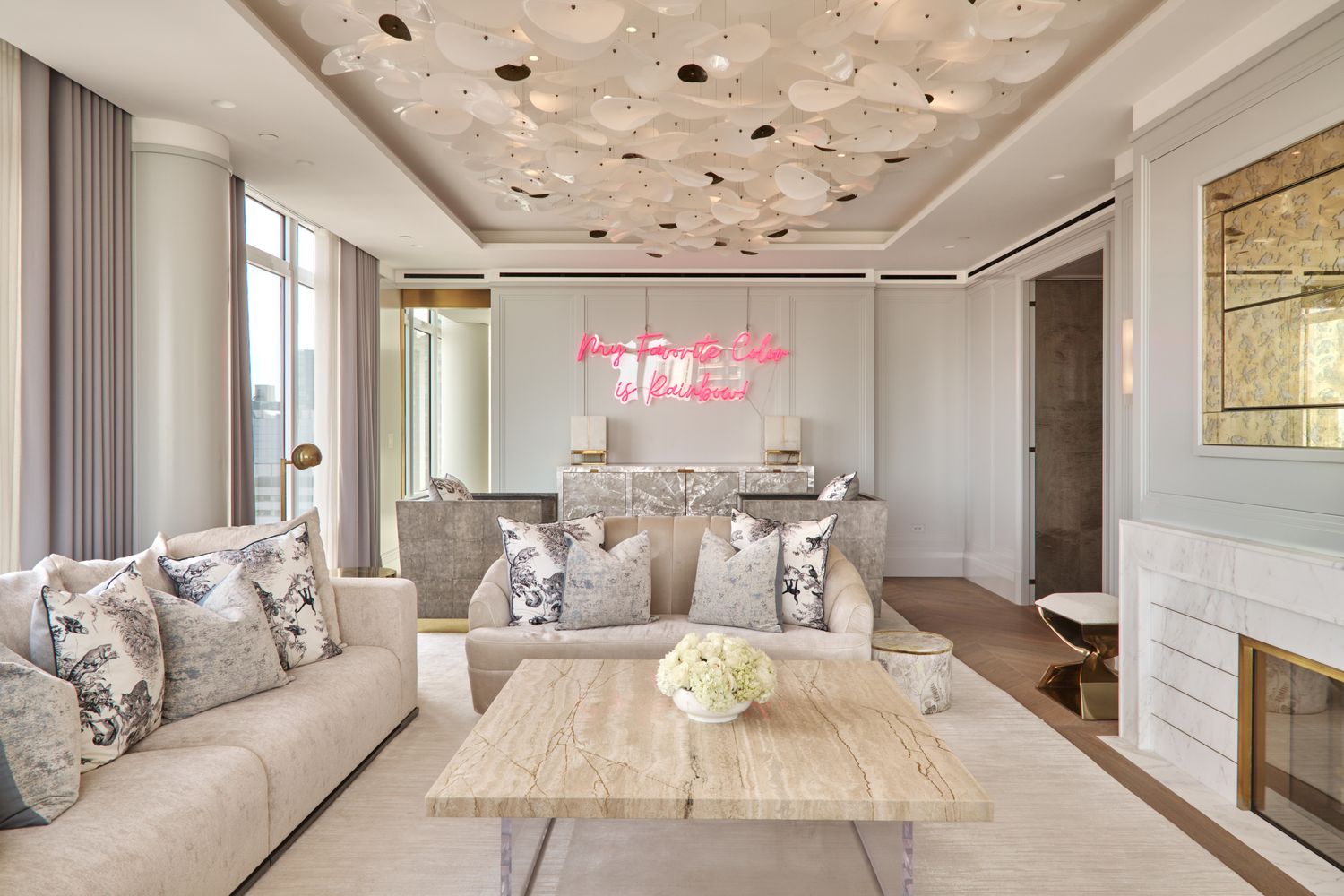 a living room with furniture and a chandelier