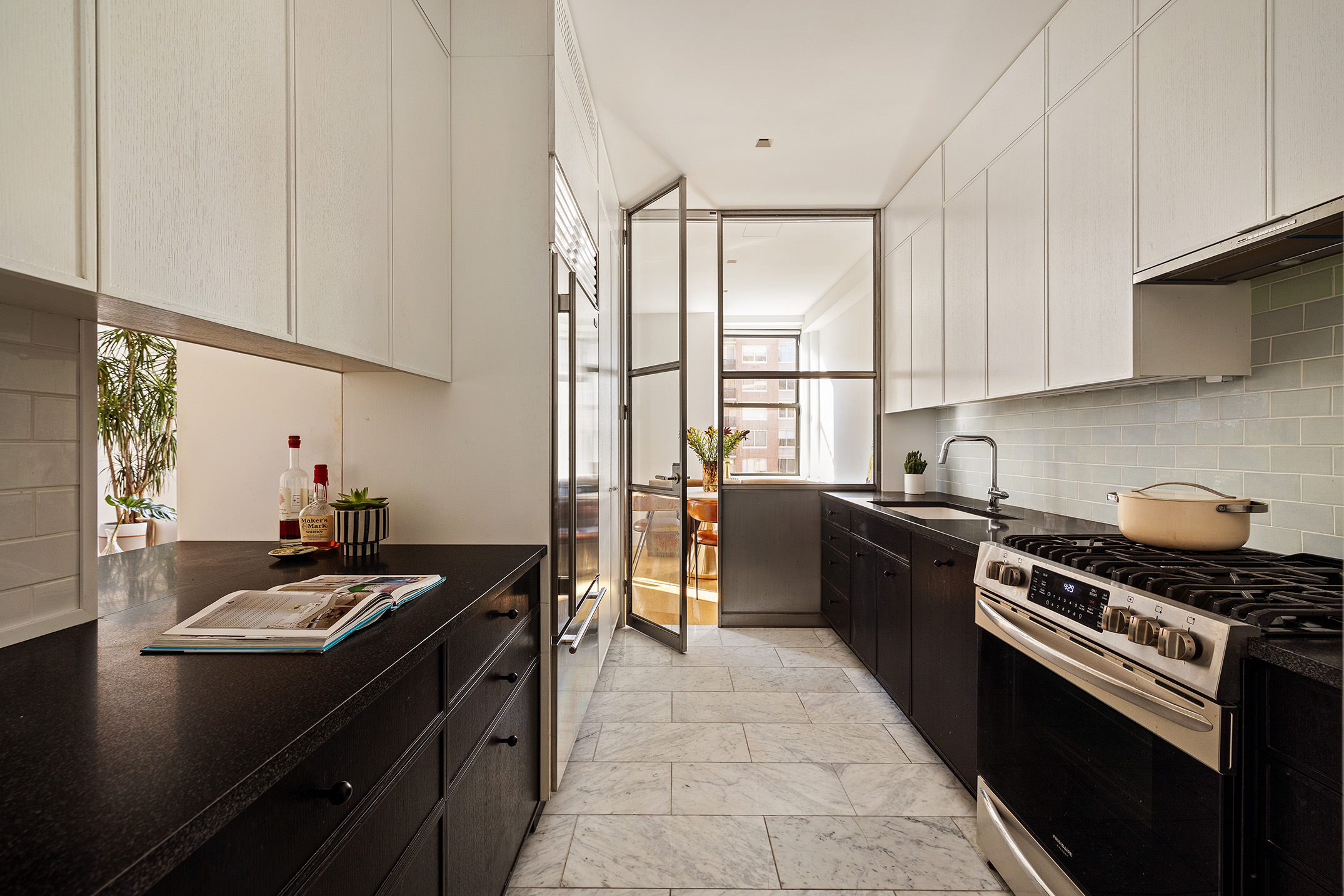 210 West 90th Street, Unit 8L Manhattan, NY 10024 - Photo 4 of 21 a kitchen with granite countertop a sink stove and refrigerator