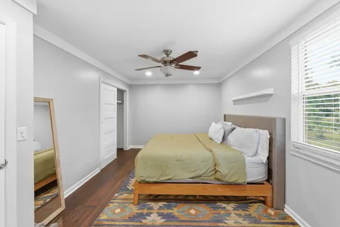 a bedroom with a bed and a walk in closet