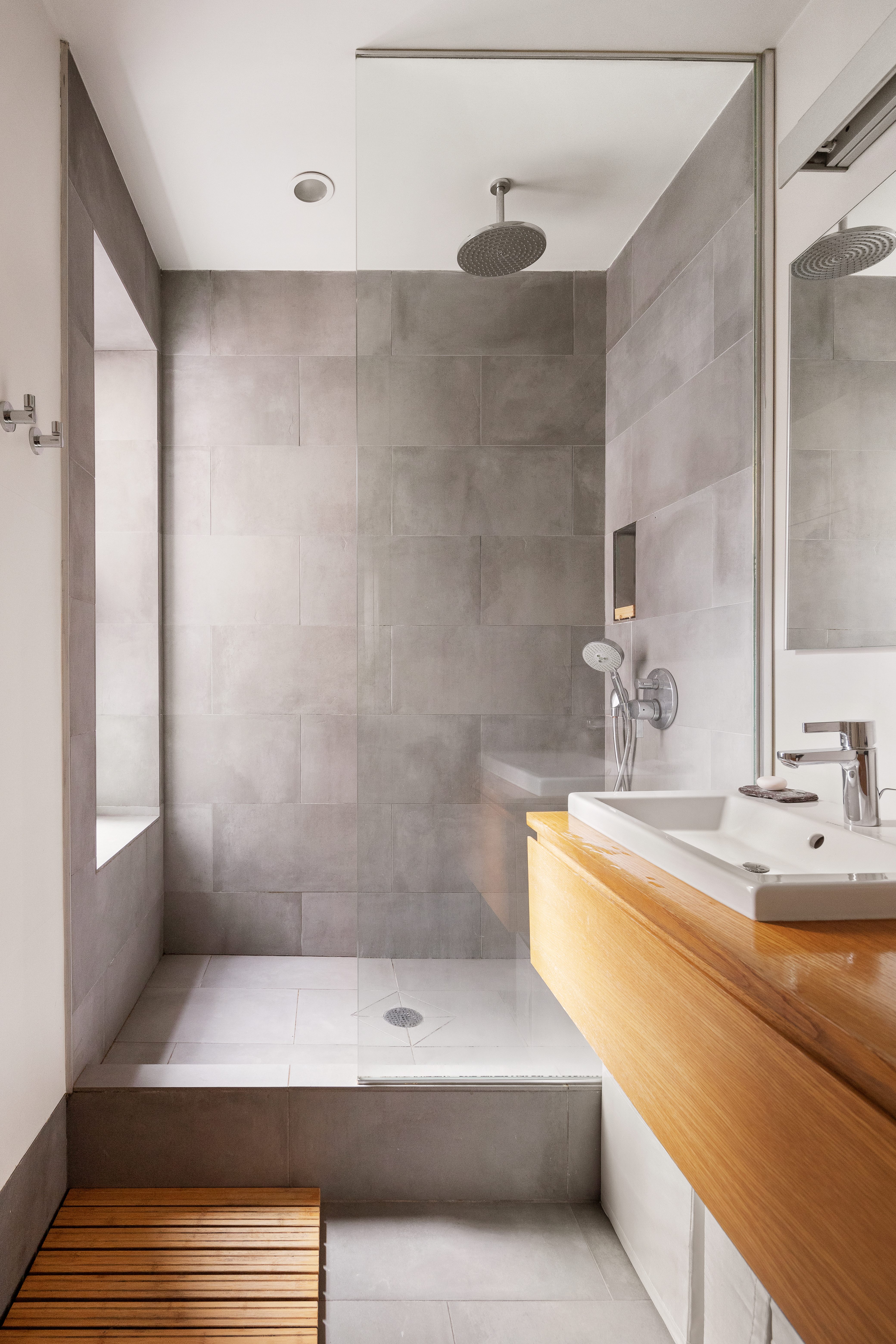 110 Suffolk Street, Unit 5A Manhattan, NY 10002 - Photo 2 of 5 a bathroom with a double vanity sink and a mirror
