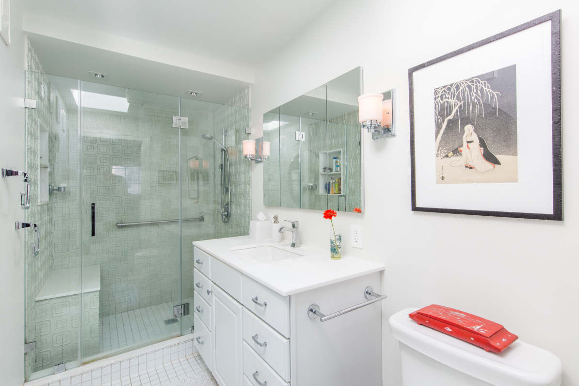 110 North 9th Street, Unit TH1 Brooklyn, NY 11249 - Photo 7 of 14 a bathroom with a sink a vanity and a shower