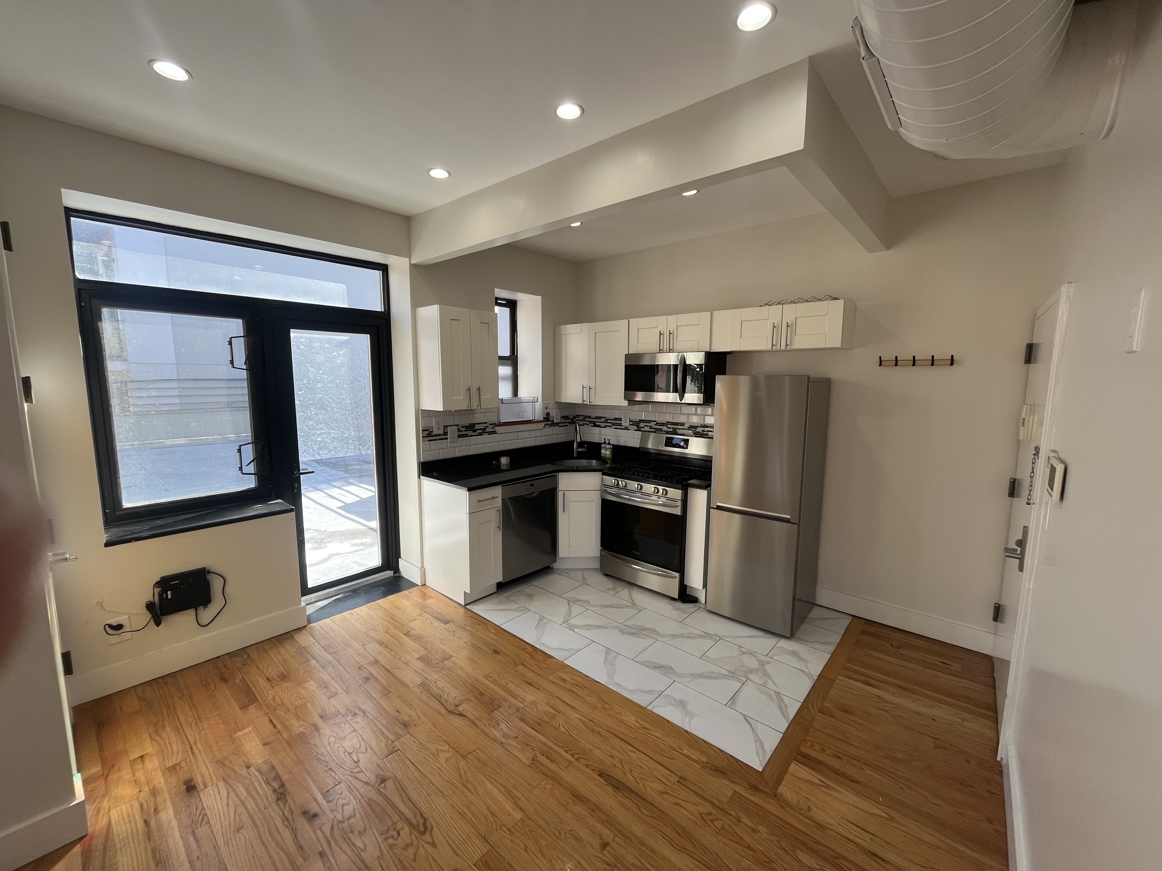 610 Monroe Street, Unit 2R Brooklyn, NY 11221 - Photo 1 of 6 a kitchen with stainless steel appliances granite countertop a refrigerator a stove and a sink