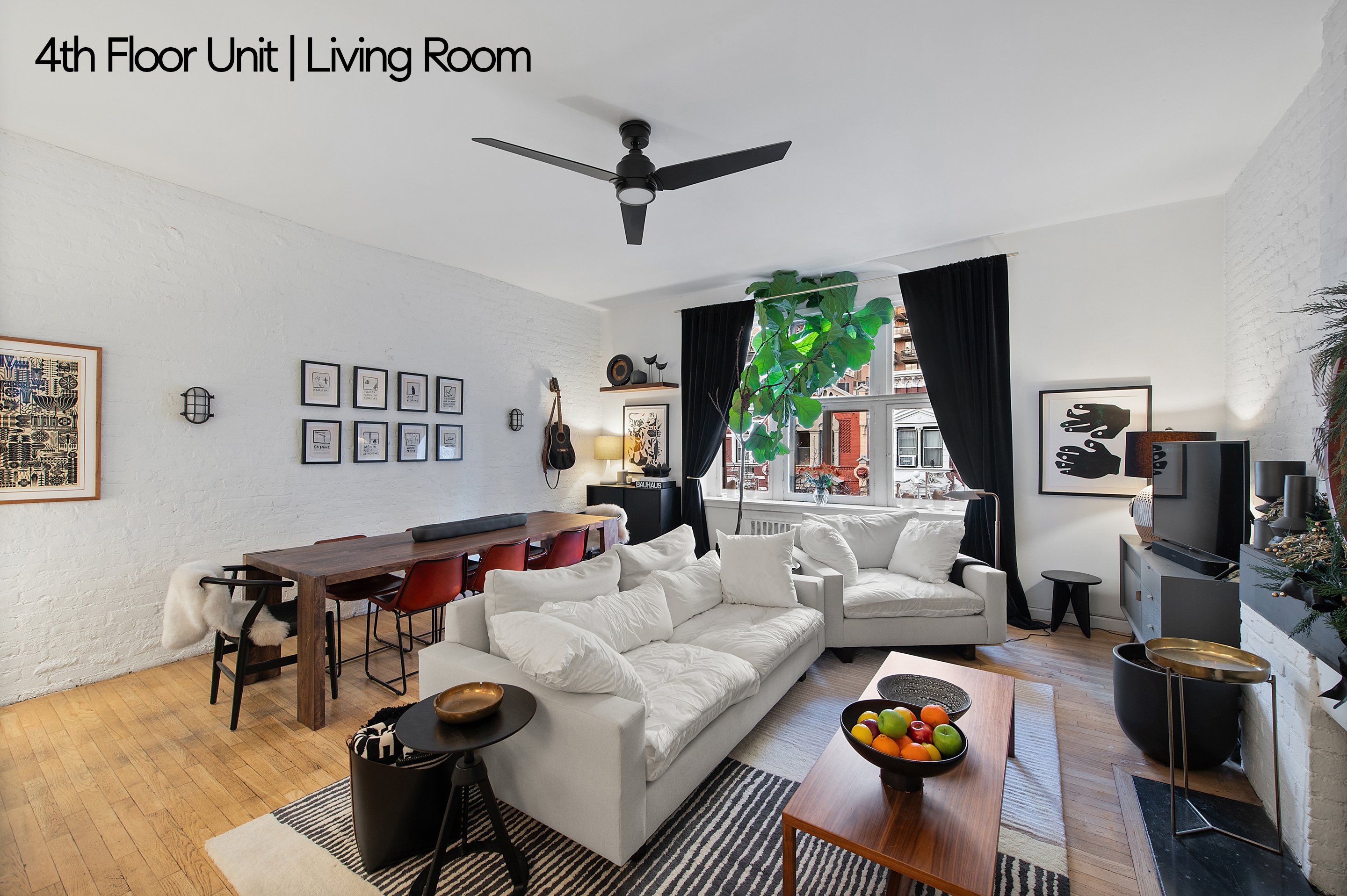 126 West 78th Street Manhattan, NY 10024 - Photo 19 of 39 a living room with furniture and a large window