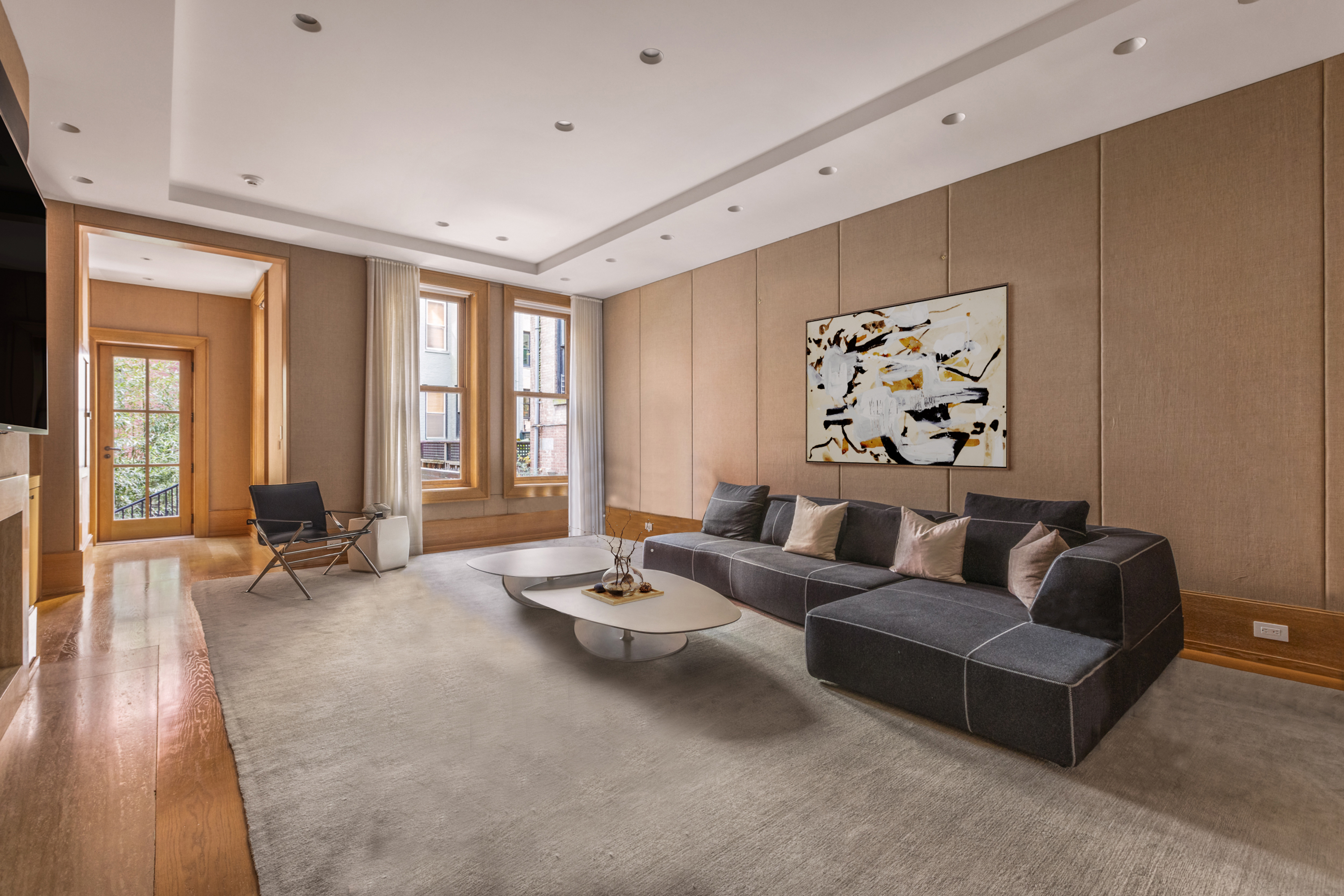 45 East 74th Street Manhattan, NY 10021 - Photo 7 of 33 a living room with furniture and wooden floor