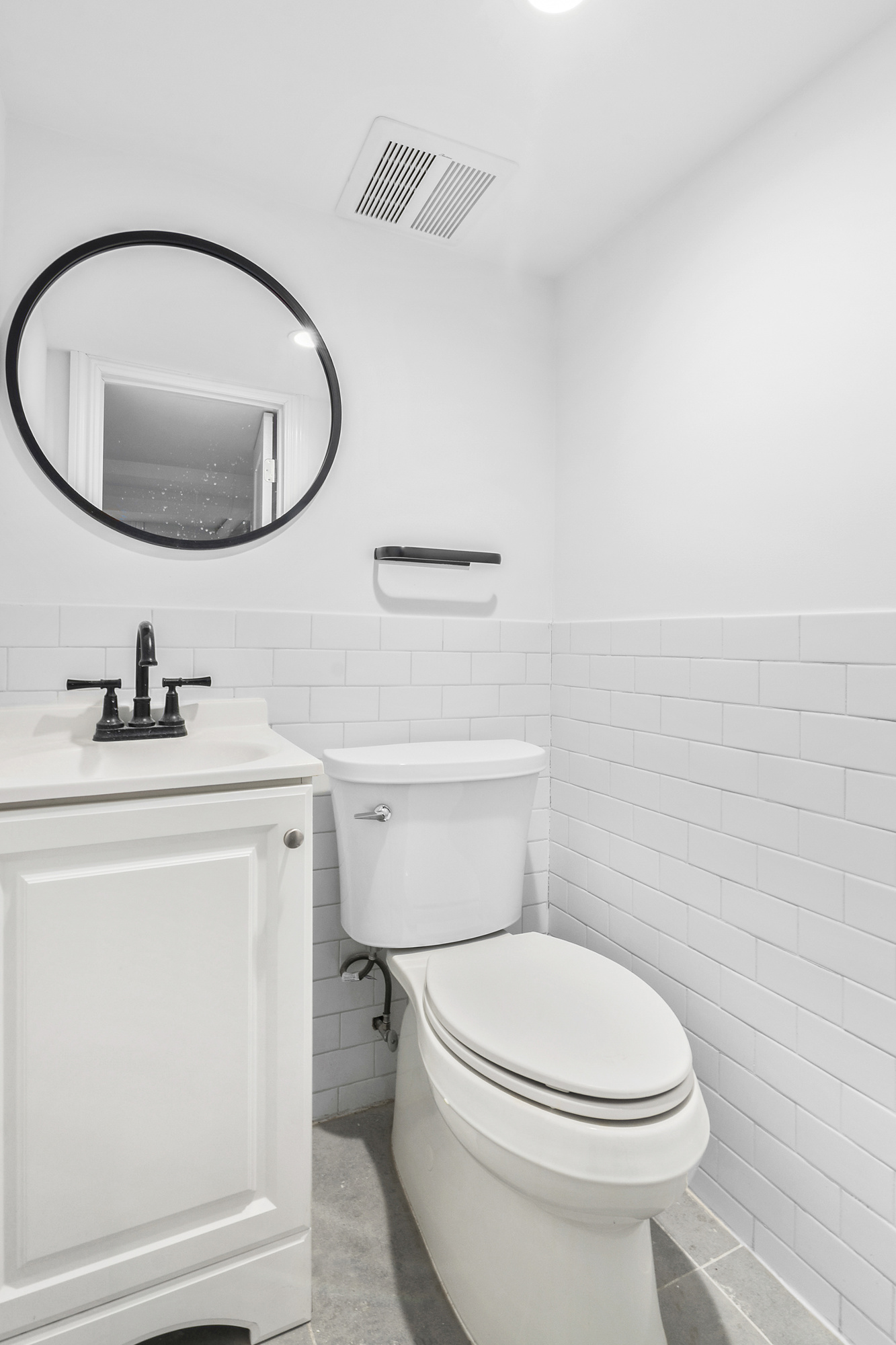 42 Eldert Street, Unit 1 Brooklyn, NY 11207 - Photo 8 of 10 a bathroom with a toilet a sink and mirror