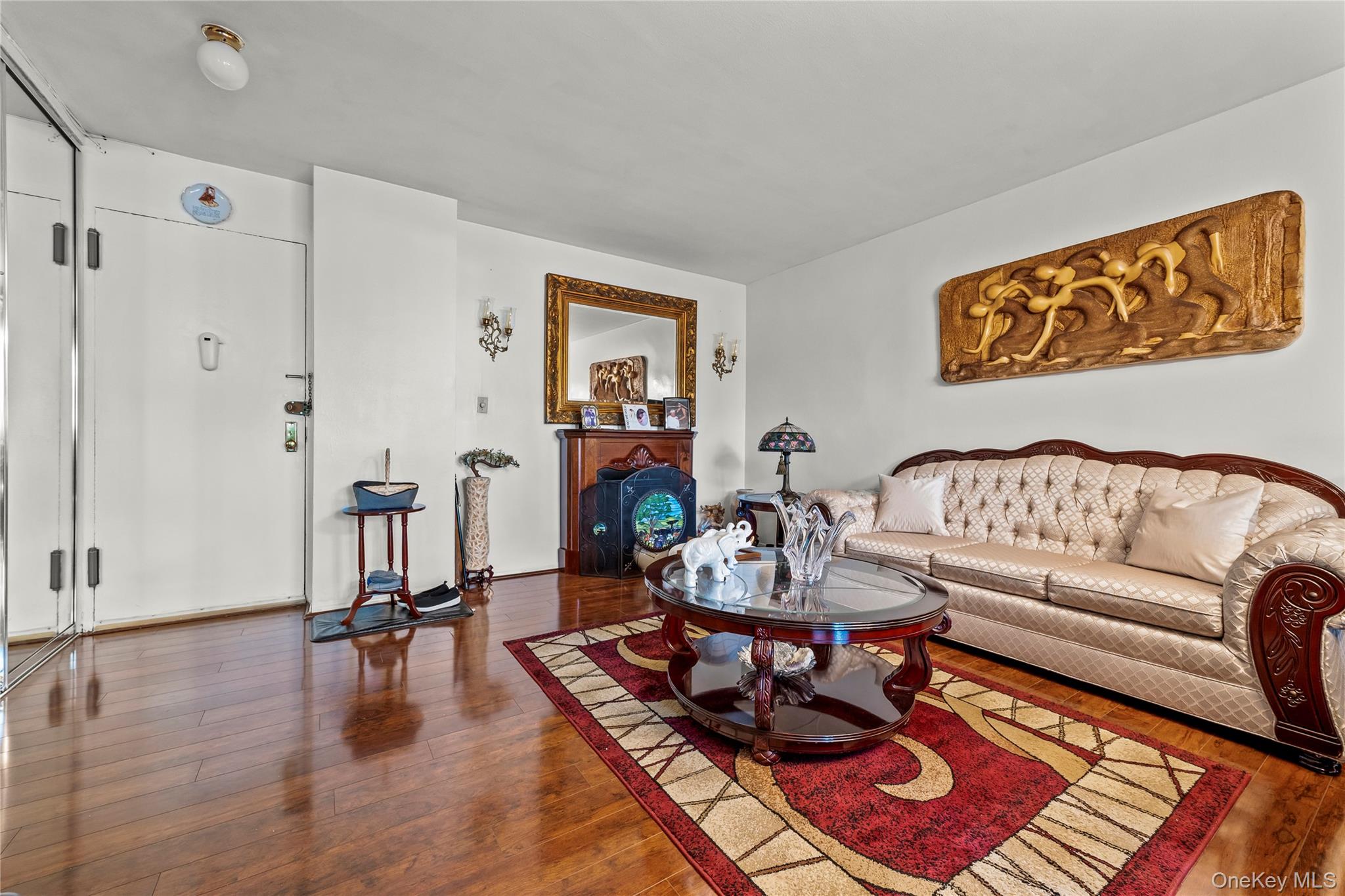 12399 Flatlands Avenue, Unit 1L Brooklyn, NY 11207 - Photo 3 of 21 a living room with furniture and a wooden floor