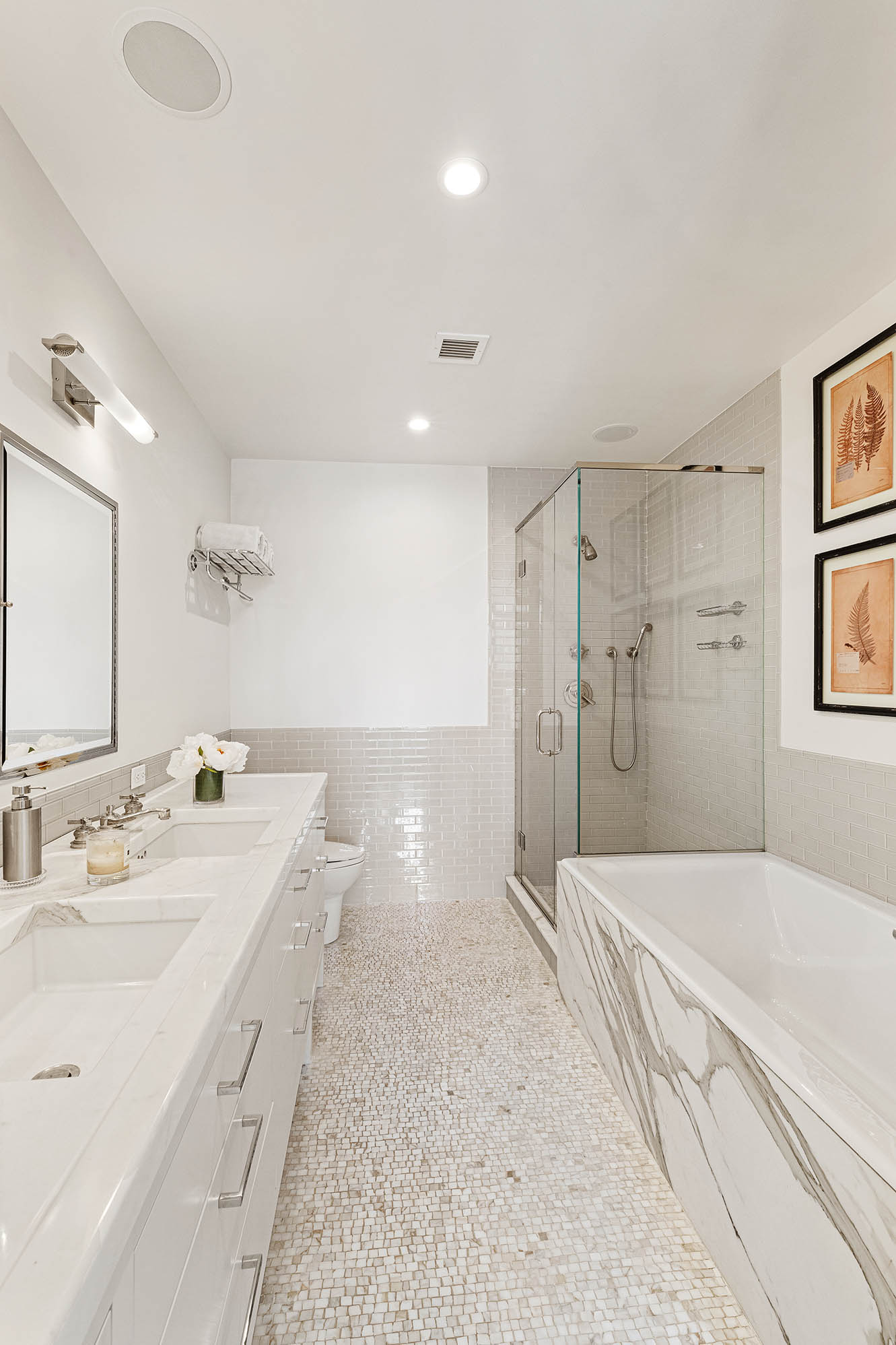 545 West 110th Street, Unit PH11A Manhattan, NY 10025 - Photo 12 of 22 a spacious bathroom with a double vanity sink mirror and shower