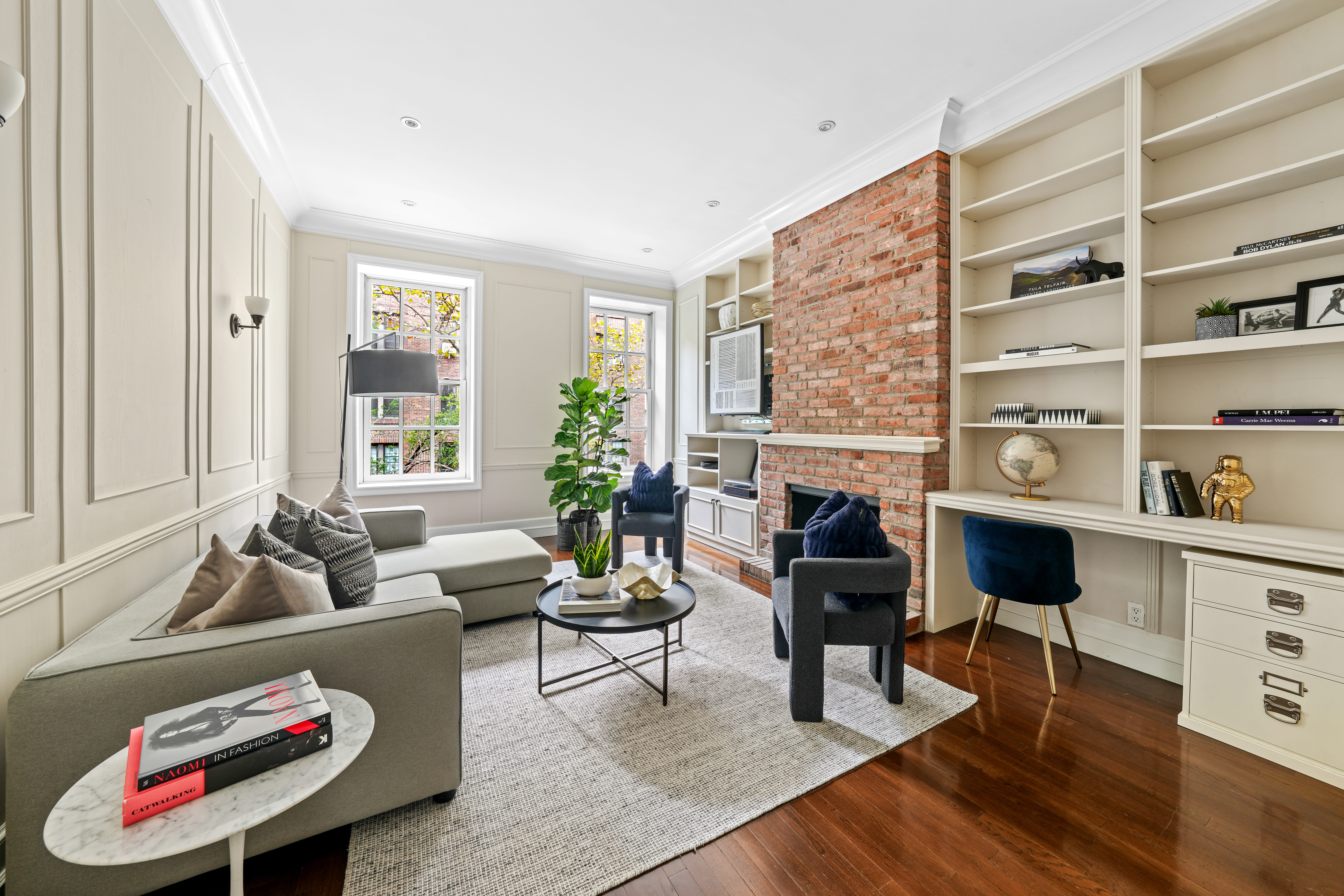 247 East 71st Street Manhattan, NY 10021 - Photo 14 of 31 a living room with furniture and a fireplace