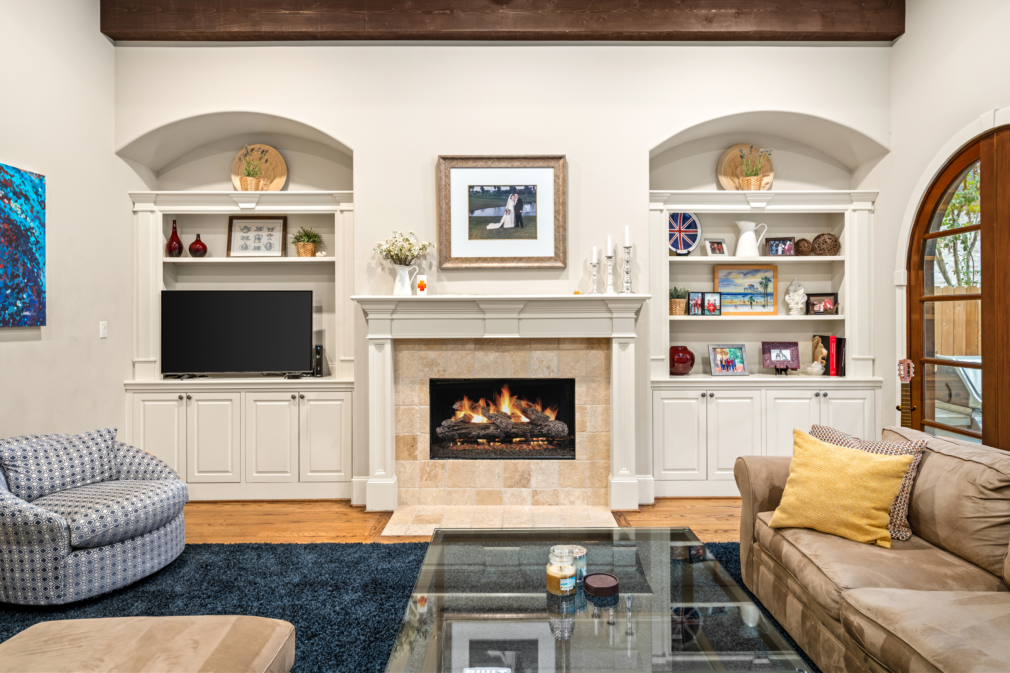 4219 Oberlin Street West University Place, TX 77005 - Photo 7 of 33 a living room with fireplace furniture and a flat screen tv
