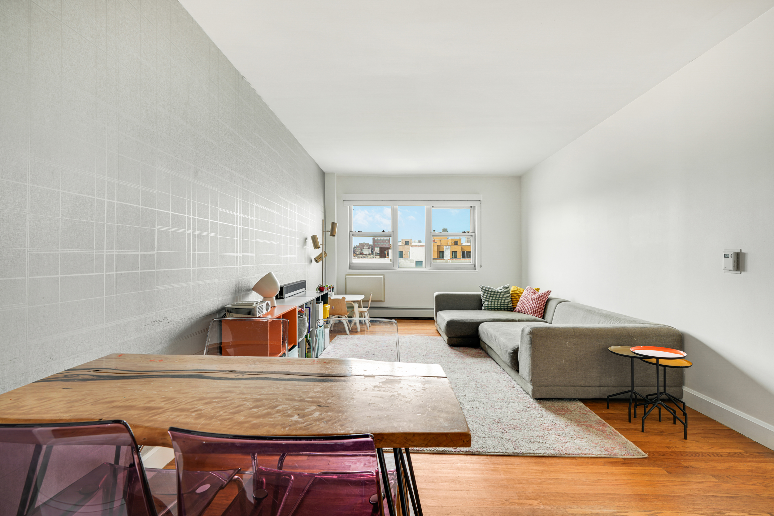 1820 Madison Avenue, Unit 7C Manhattan, NY 10035 - Photo 6 of 17 a living room with furniture and a wooden floor